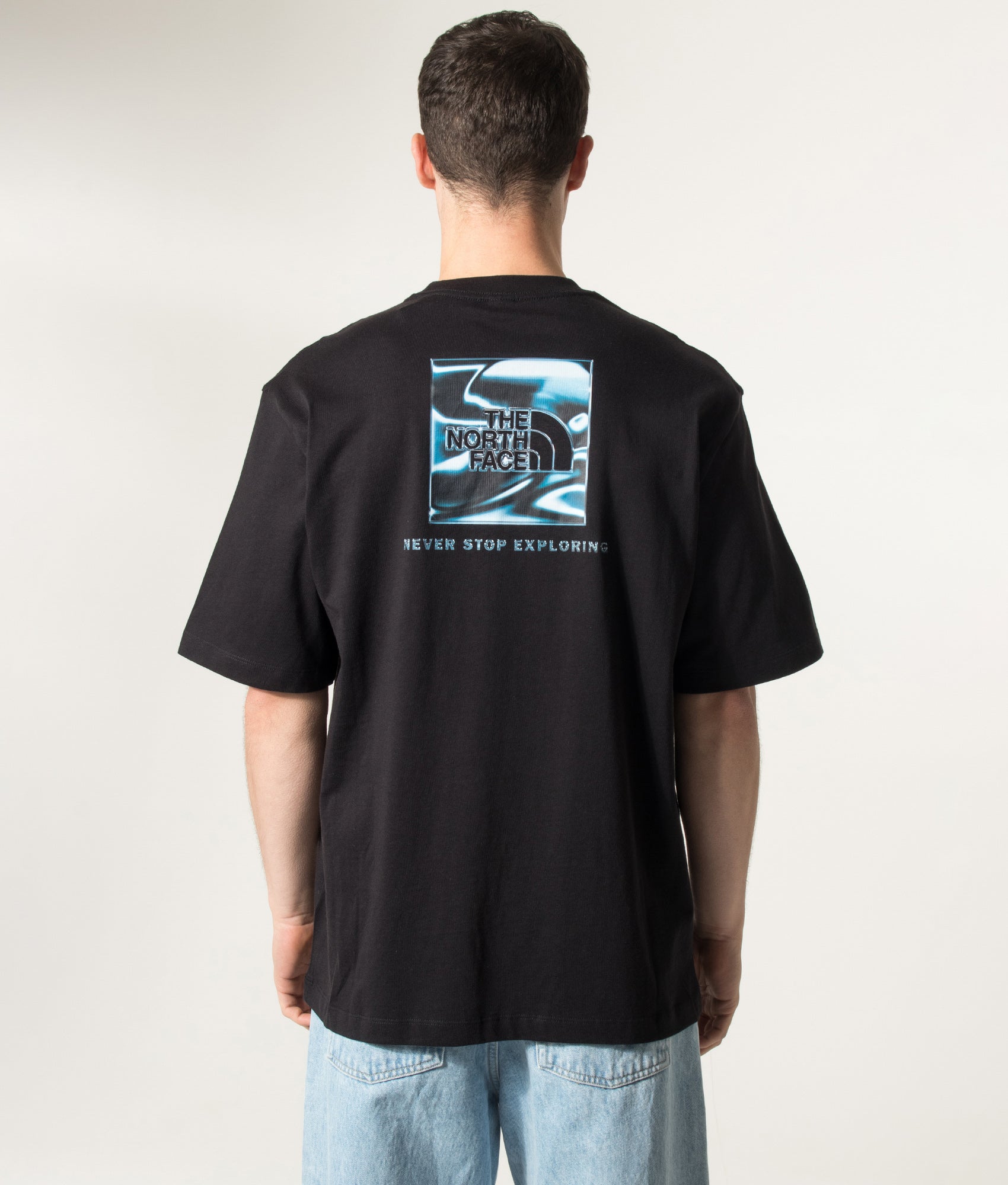 The North Face Oversized Liquid NSE Box Graphic T-Shirt in TNF Black at EQVVS Menswear. Model back shot.