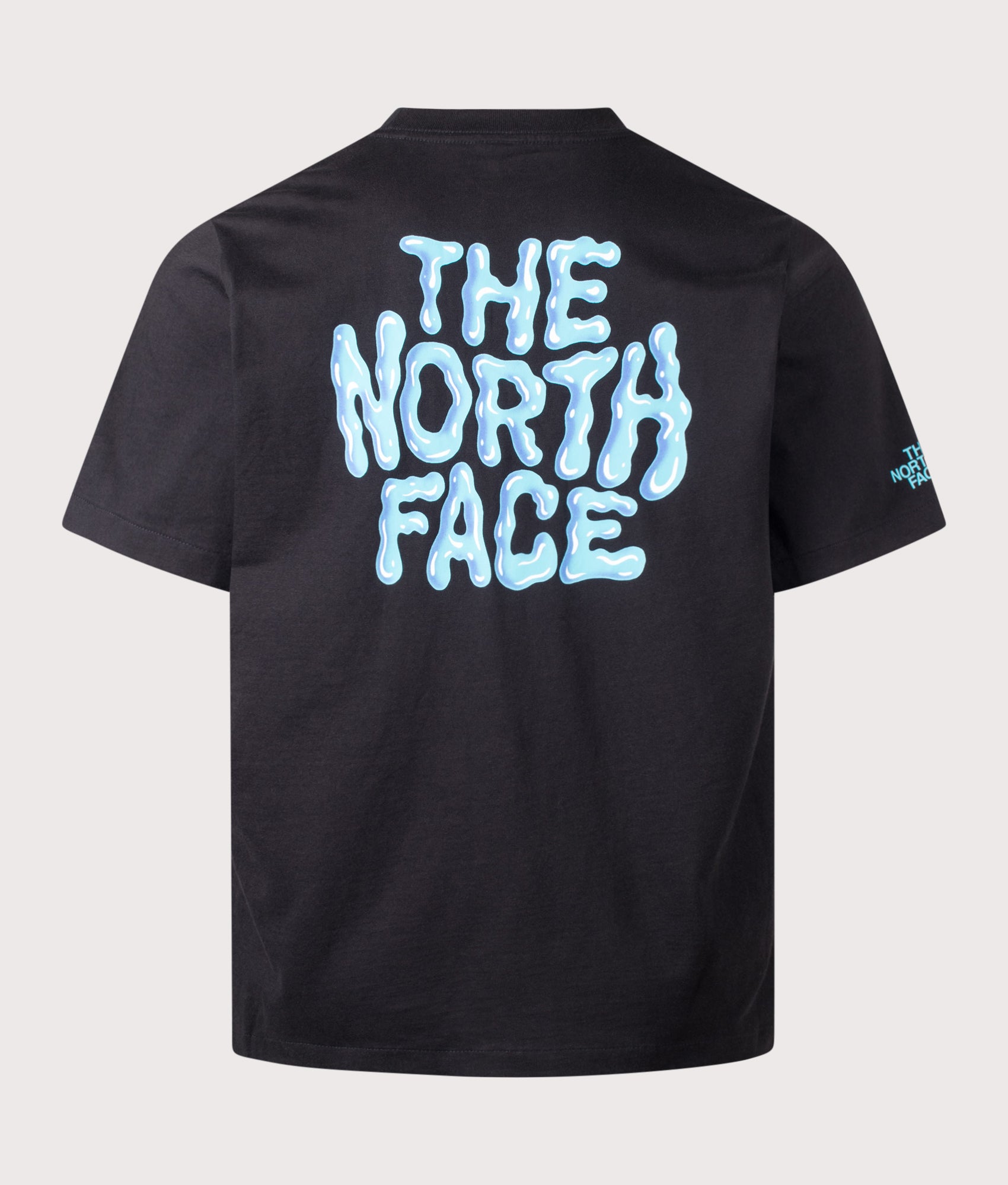 The North Face Relaxed Fit Drip Logo T-Shirt in TNF Black at EQVVS Menswear. Back shot.