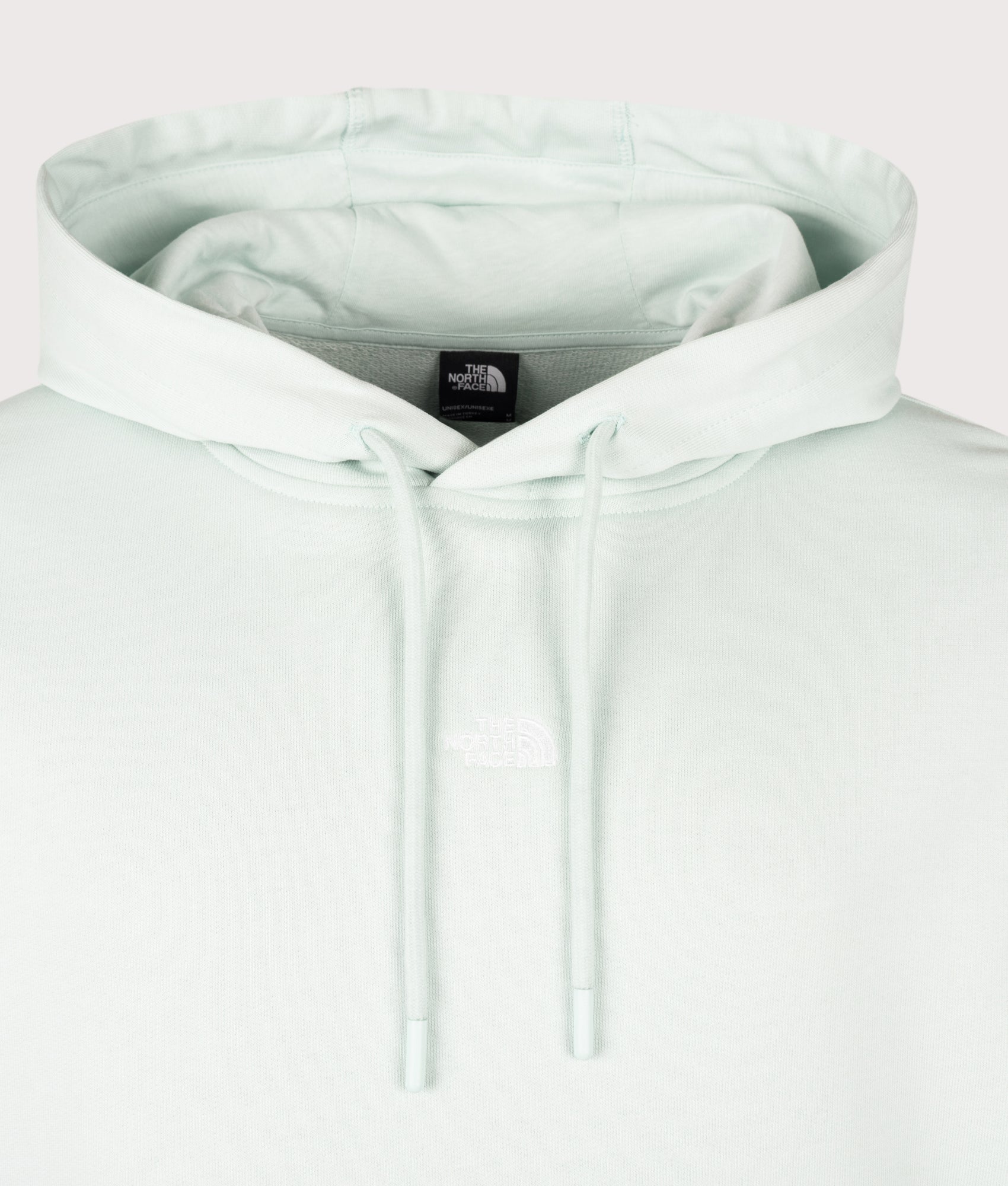 Relaxed Fit Essential Hoodie in Opal Frost by The North Face. Shot by EQVVS. Detail shot.