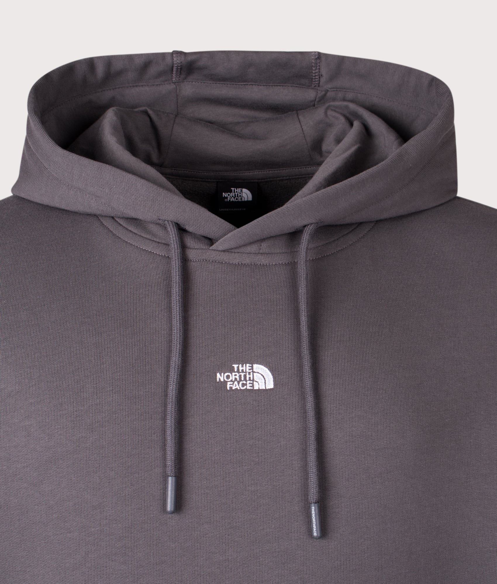 Relaxed Fit Essential Hoodie in Anthracite Grey by The North Face. Shot by EQVVS. Front Detail Shot.
