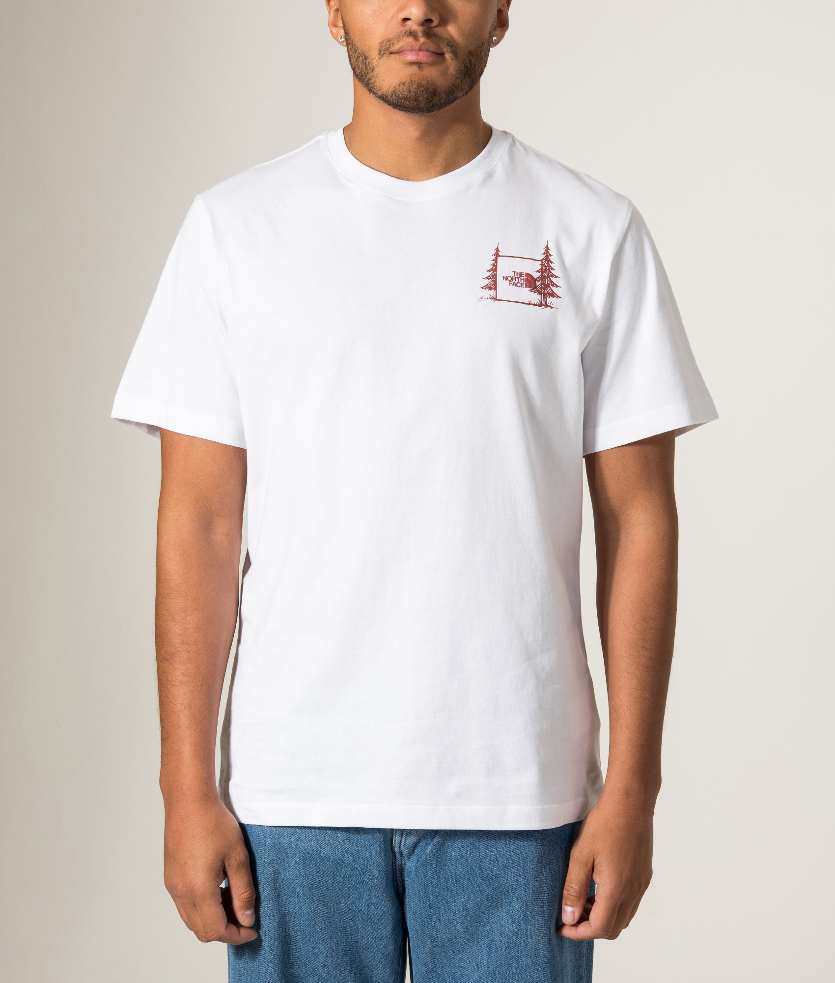 The North Face Relaxed Fit Camping T-Shirt in TNF White at EQVVS Menswear. Model front shot.