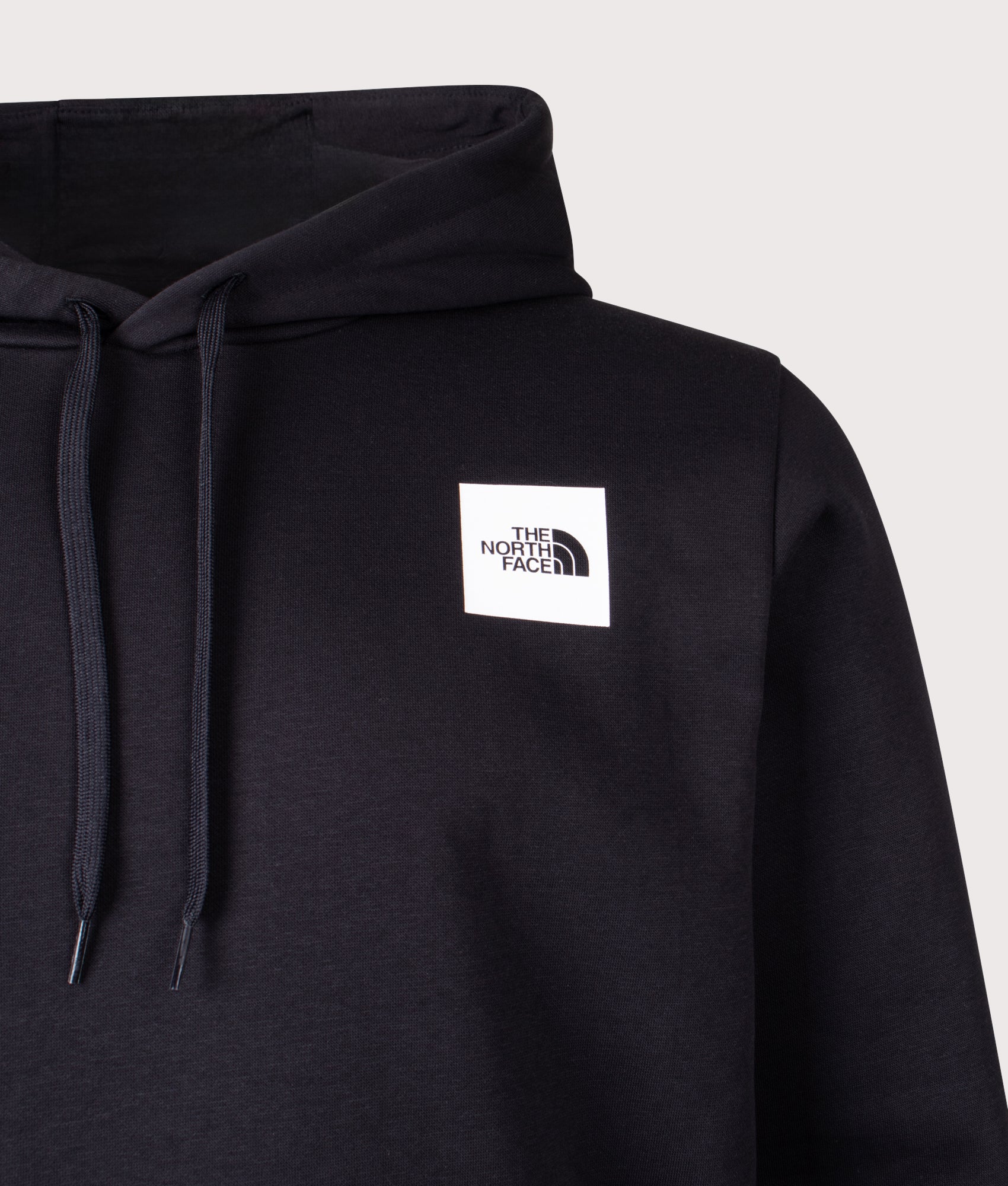 The North Face Evolution Box Hoodie in TNF Black at EQVVS Menswear. Detail shot.