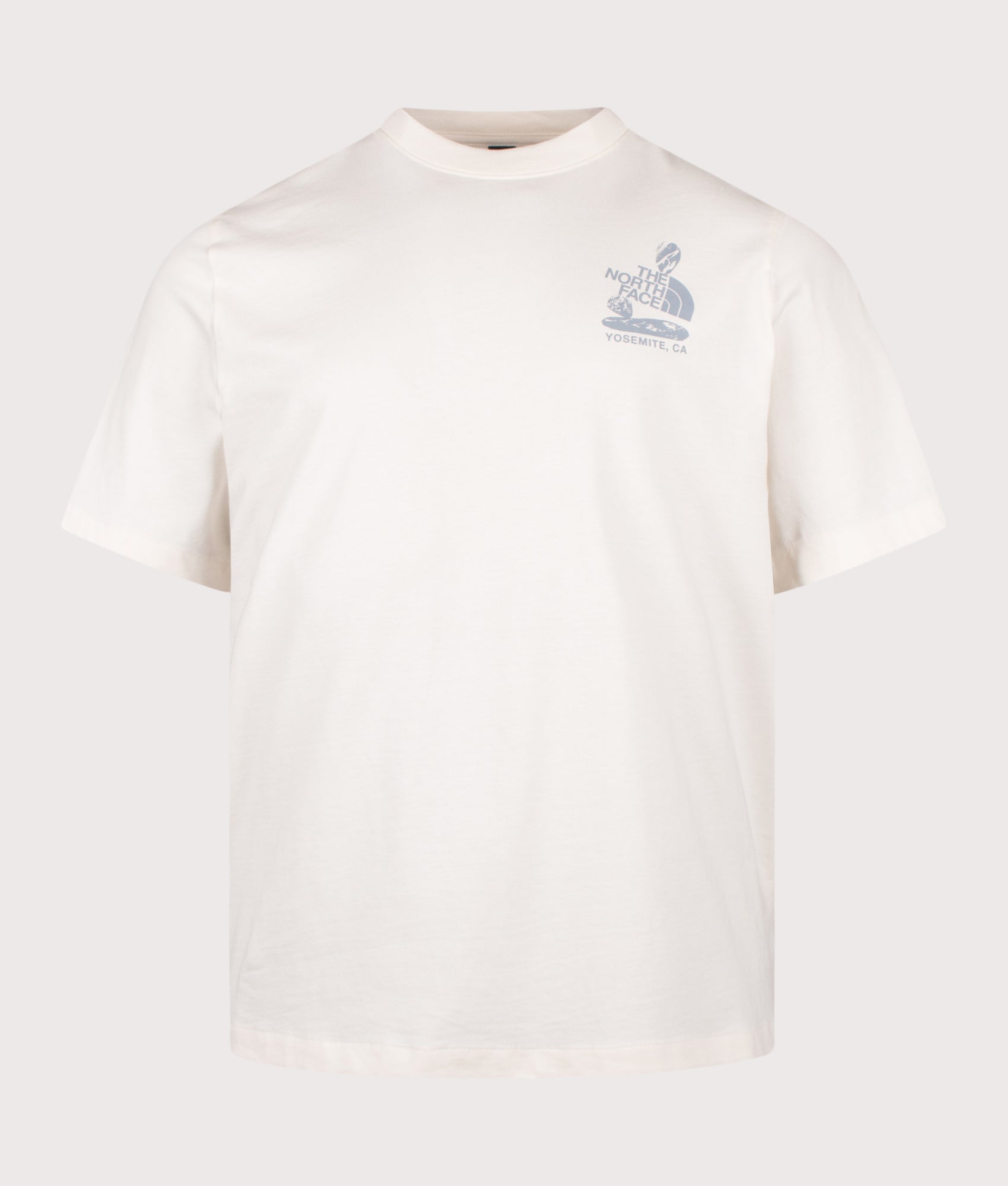 The North Face Relaxed Fit Stones Graphic T-Shirt in White Dune at EQVVS Menswear. Front shot.