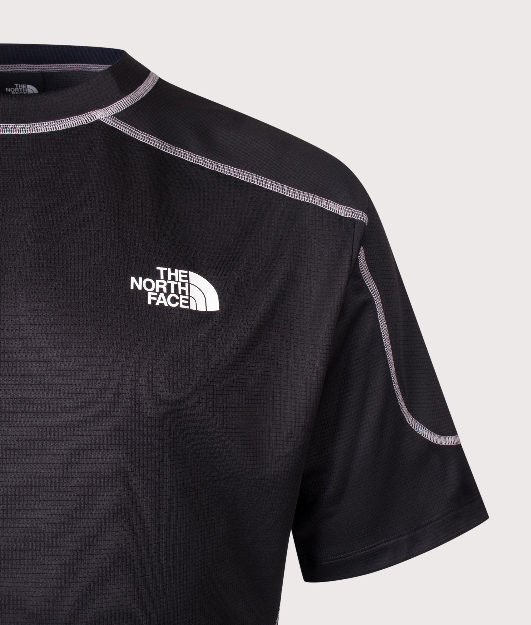 The North Face Relaxed Fit NSE Lightrange T-Shirt in TNF Black at EQVVS Menswear. Detail shot. 