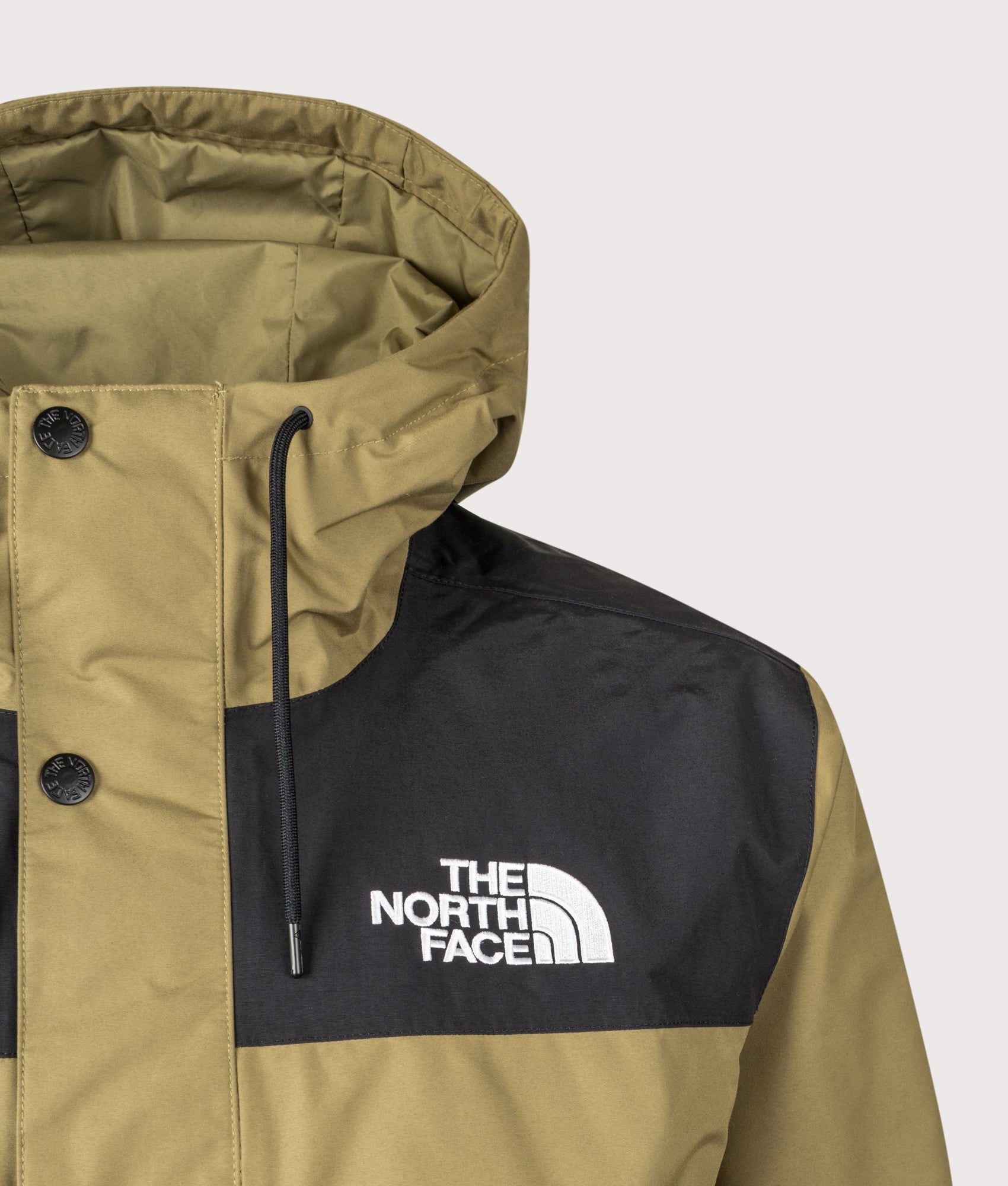 The North Face Relaxed Fit Reign On Jacket in Cedar and TNF Black at EQVVS Menswear. Front detail shot.