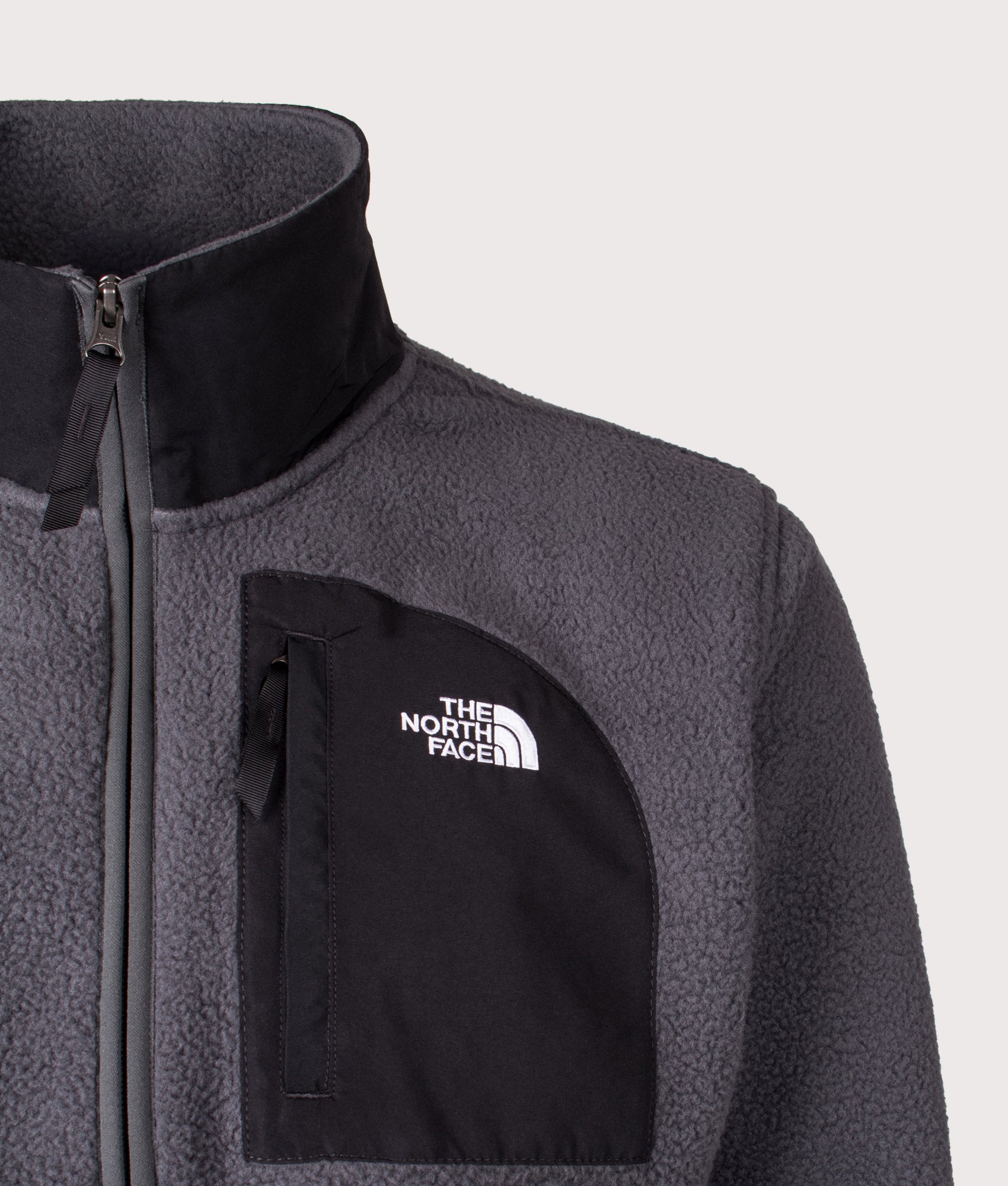 The North Face Yumiori Off-Peak Quarter Zip Fleece in Asphalt Grey and TNF Black at EQVVS Menswear. Front detail shot.