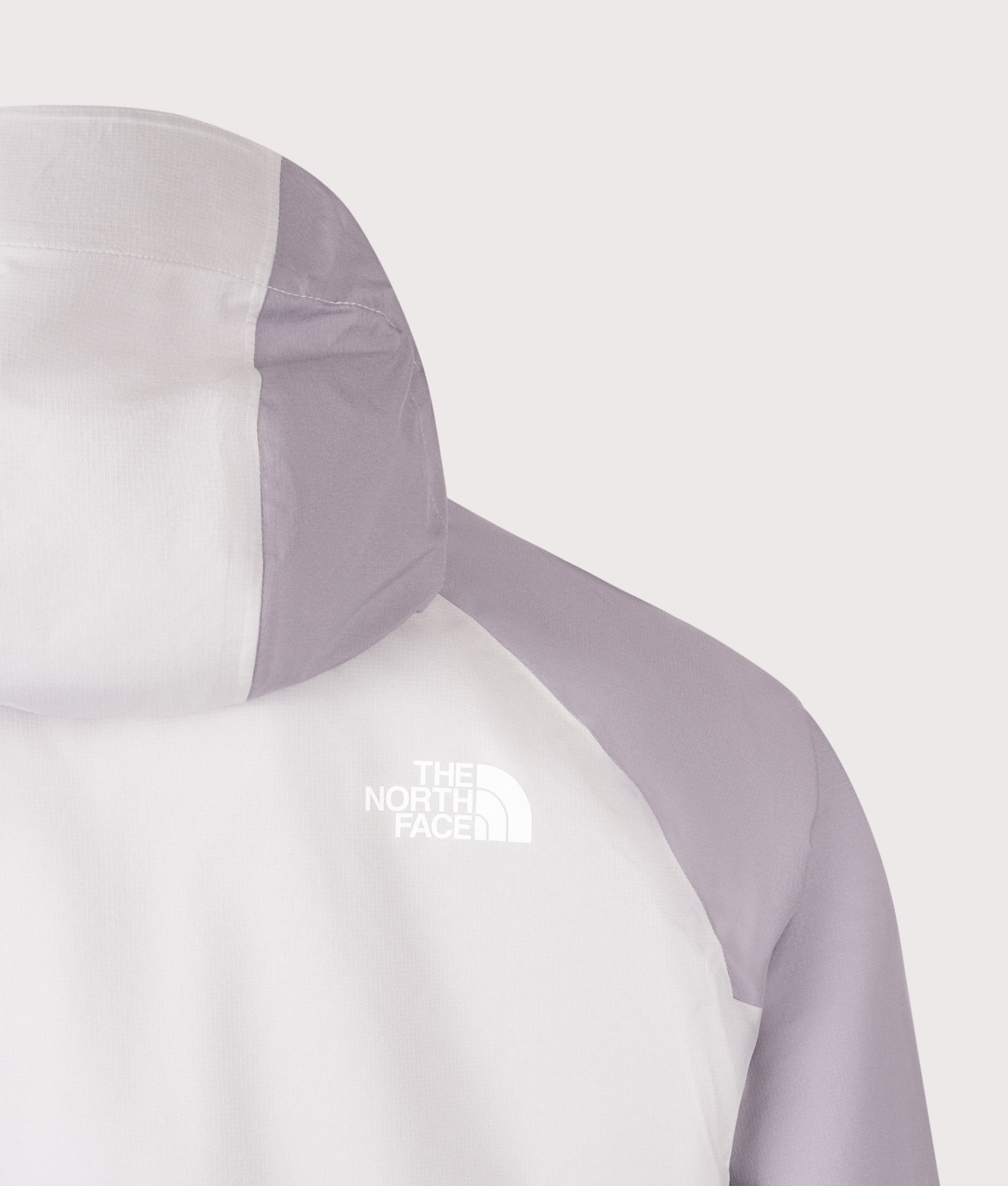 The North Face NSE Rain Jacket in Ashes Of Roses Grey and Transcendent Grey at EQVVS Menswear. Back detail shot.