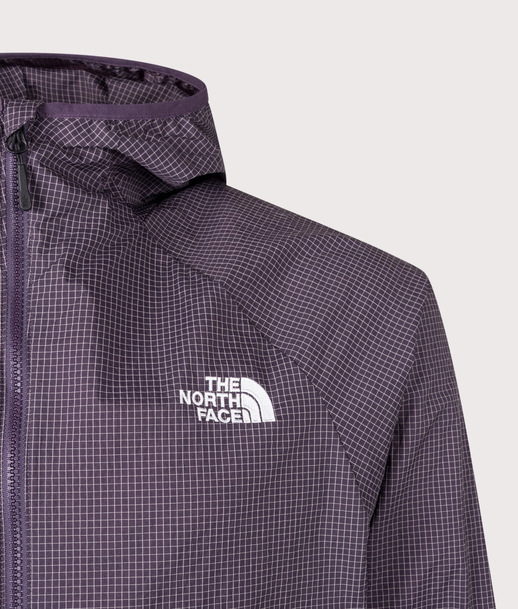 The North Face Relaxed Fit NSE Windbreaker in Endless Dusk at EQVVS Menswear. Front detail shot.