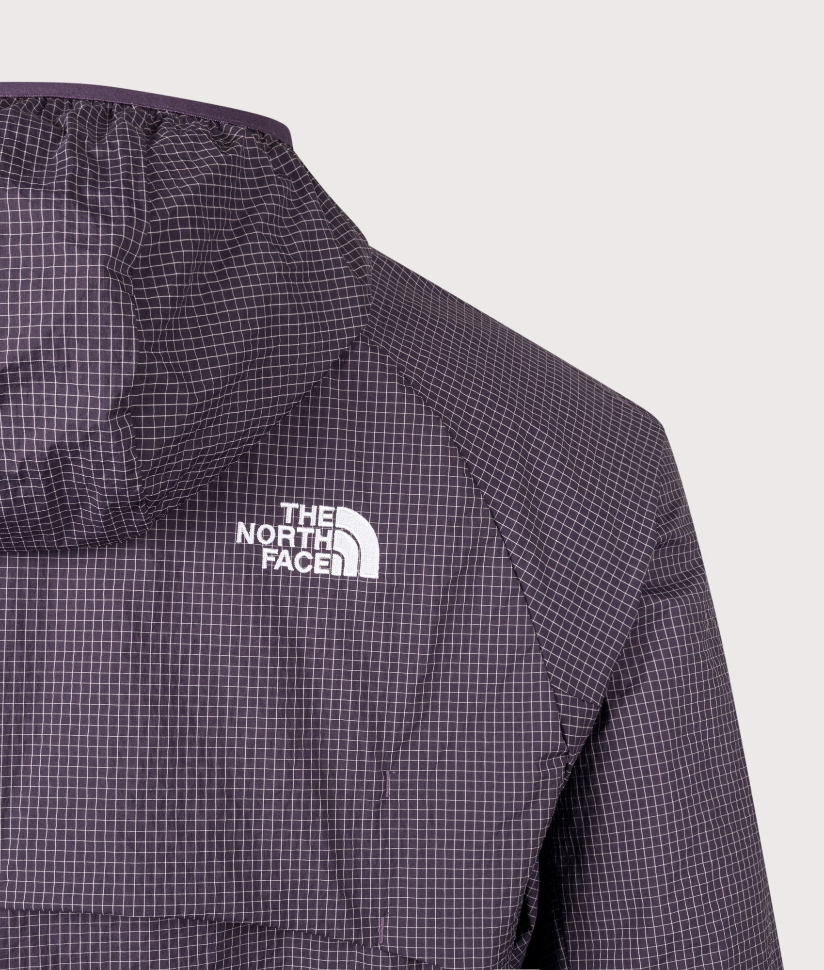 The North Face Relaxed Fit NSE Windbreaker in Endless Dusk at EQVVS Menswear. Back detail shot.
