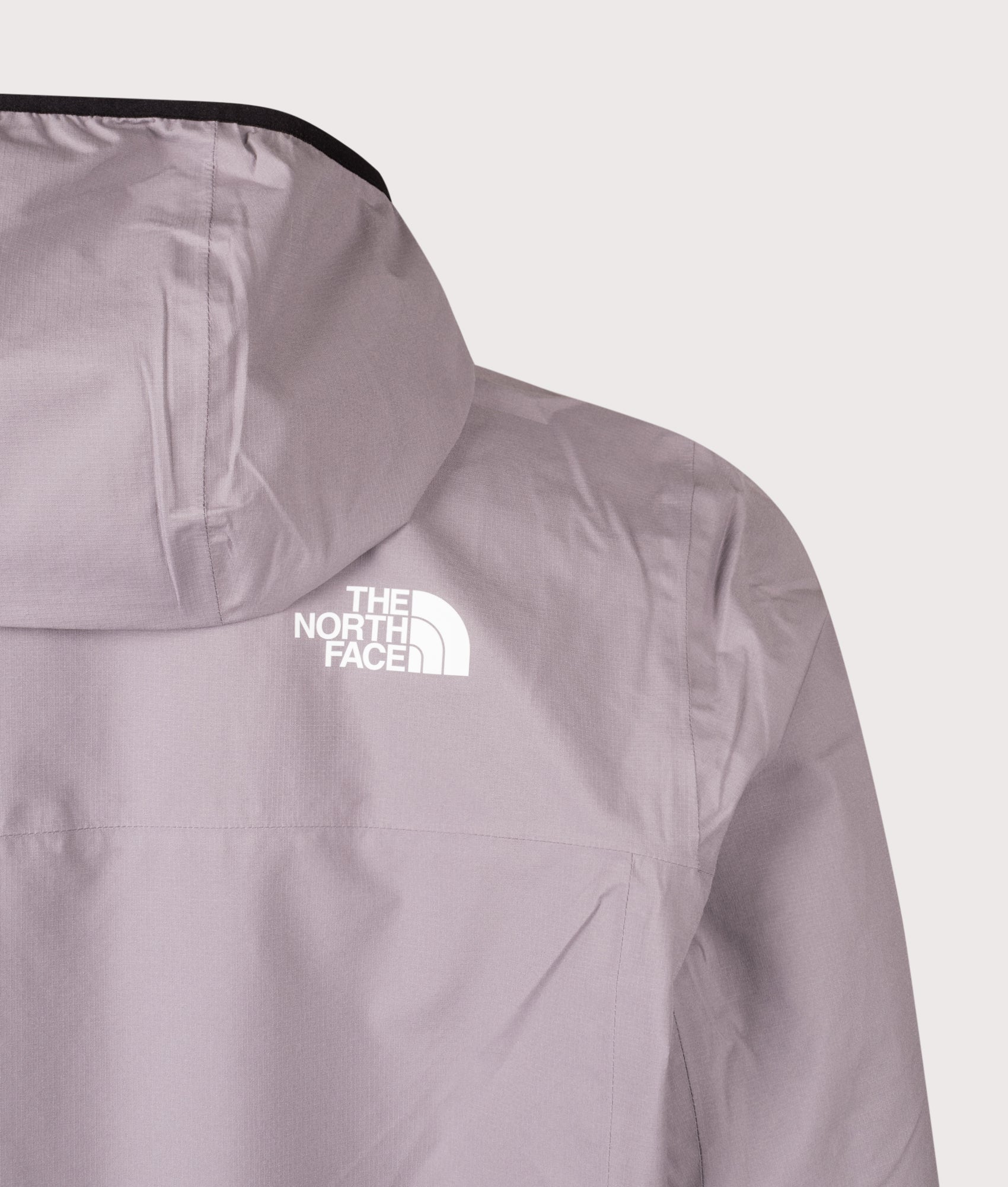 The North Face Rainlit Hooded Jacket in  Transcendent Grey at EQVVS Menswear. Back detail shot.