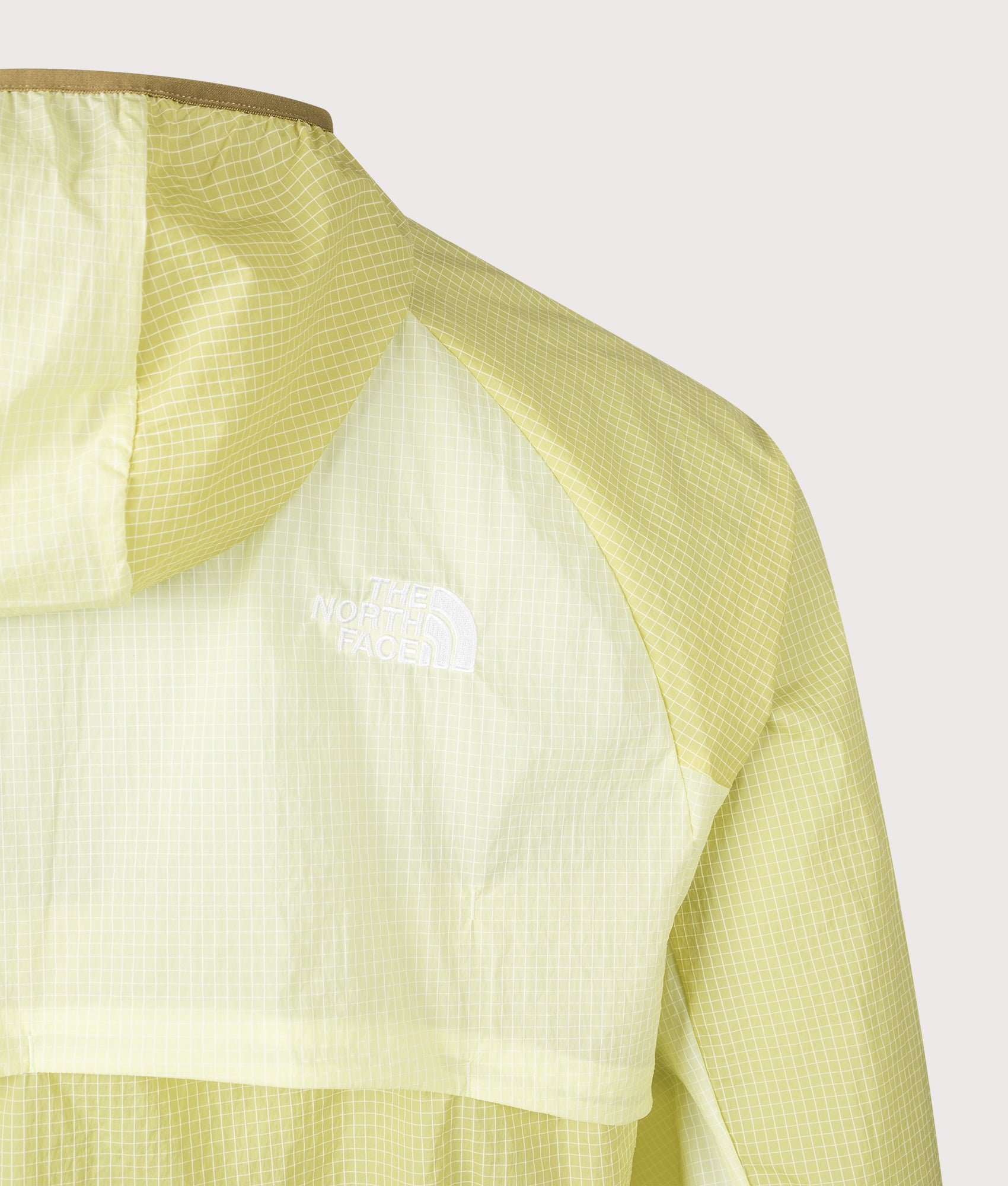 NSE Windbreaker in Lemon Mist by The North Face. Shot by EQVVS. Back Detail Shot.