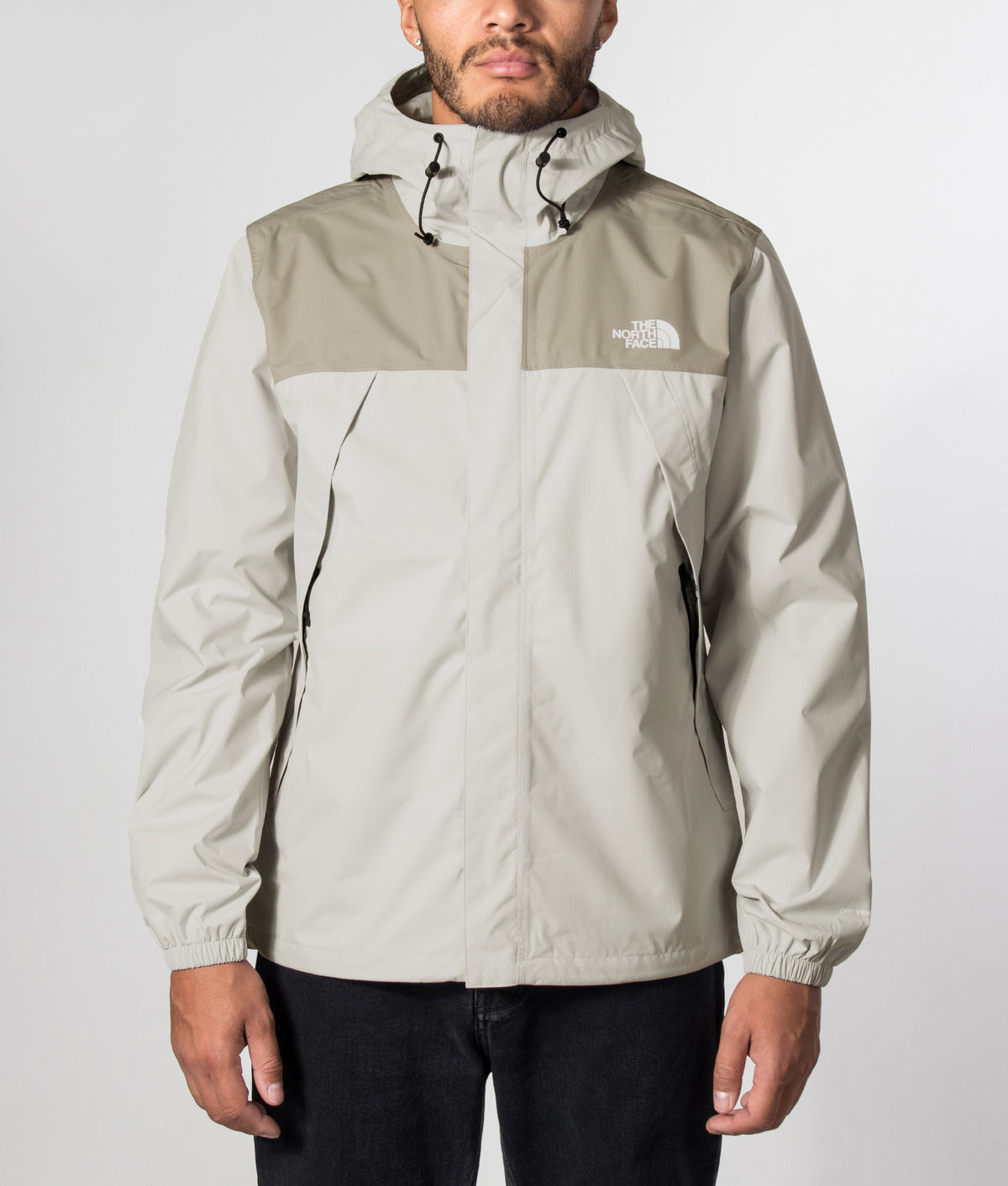The North Face Regular Fit Antora Jacket in Cumulus Cloud and Stone Slab at EQVVS Menswear. Model front shot.