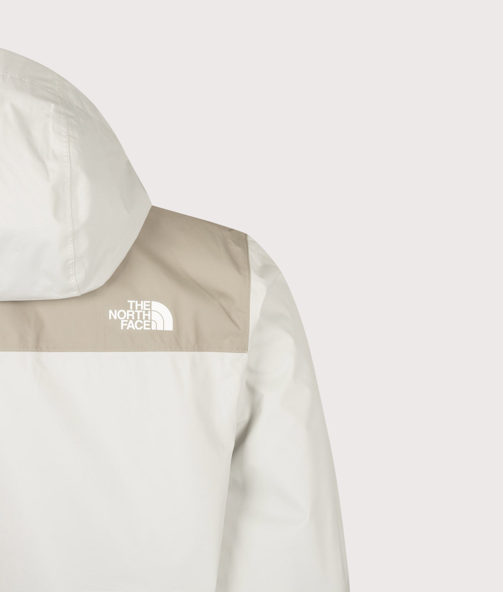 The North Face Regular Fit Antora Jacket in Cumulus Cloud and Stone Slab at EQVVS Menswear. Back detail shot.
