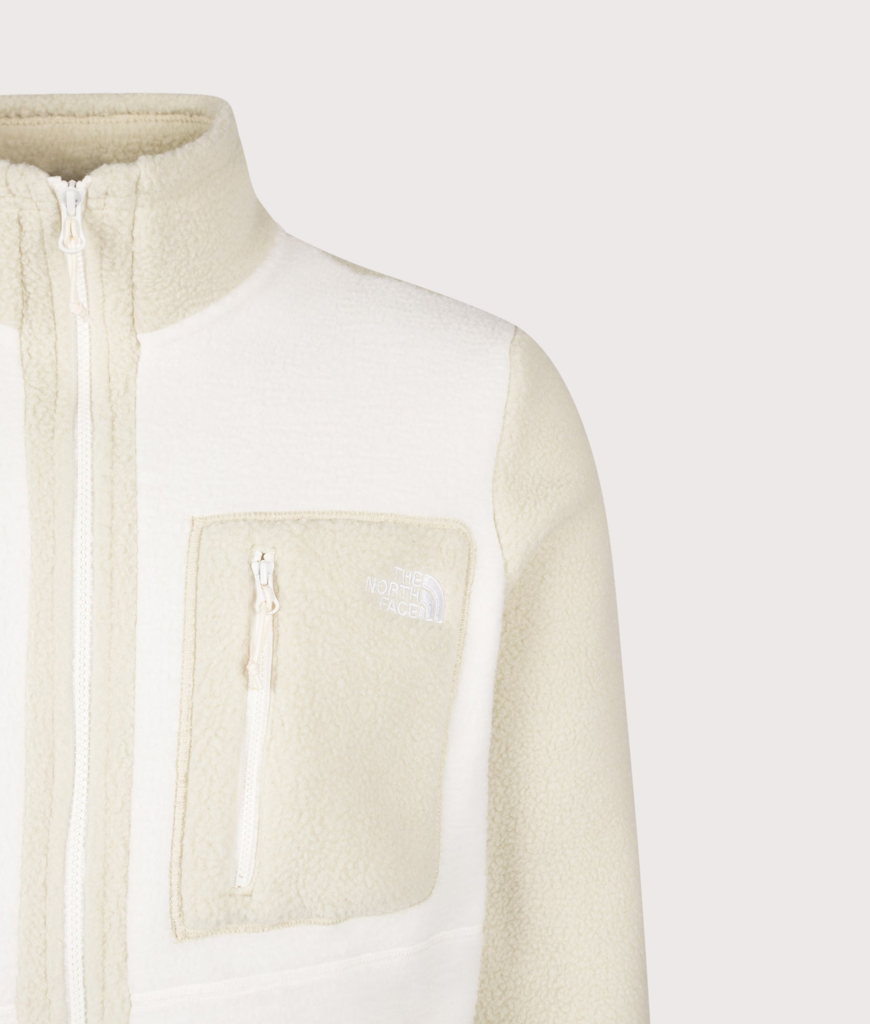 The North Face Regular Fit Yumiori Zip Through Fleece in White Dune/Desert Stone at EQVVS Menswear. Detail shot.