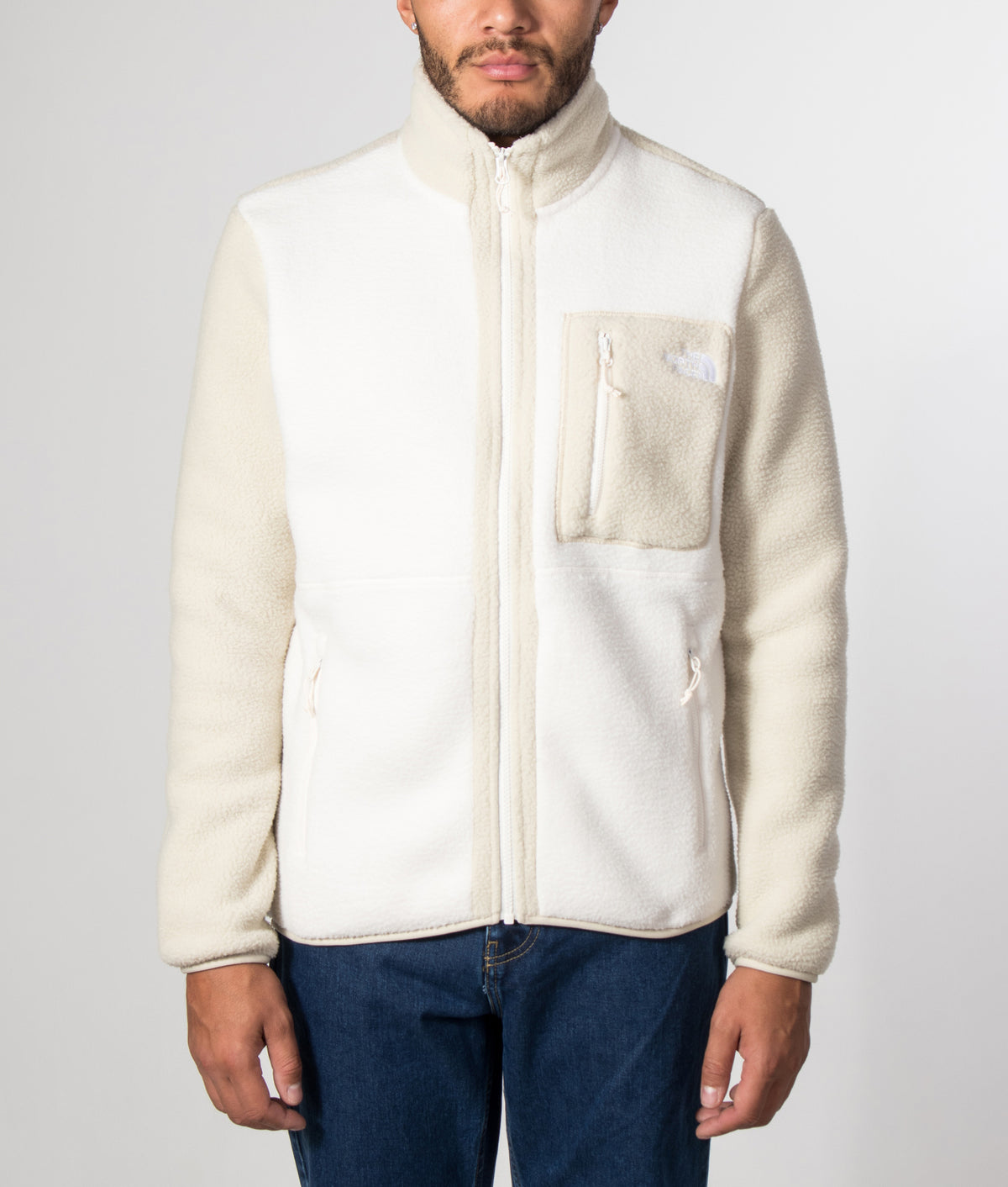 The North Face Regular Fit Yumiori Zip Through Fleece in White Dune/Desert Stone at EQVVS Menswear. Model front shot.
