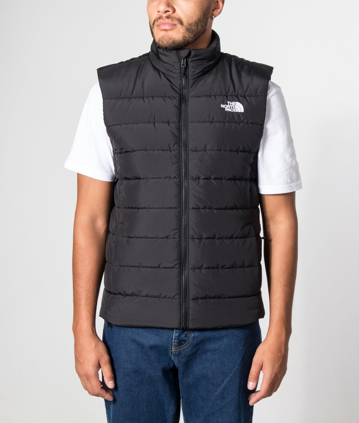 The North Face Regular Fit Aconcagua Gilet in TNF Black at EQVVS Menswear. Model front shot.