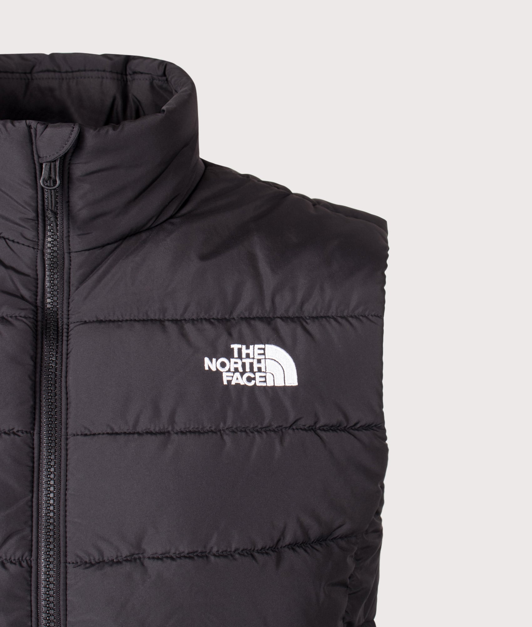 The North Face Regular Fit Aconcagua Gilet in TNF Black at EQVVS Menswear. Detail shot.