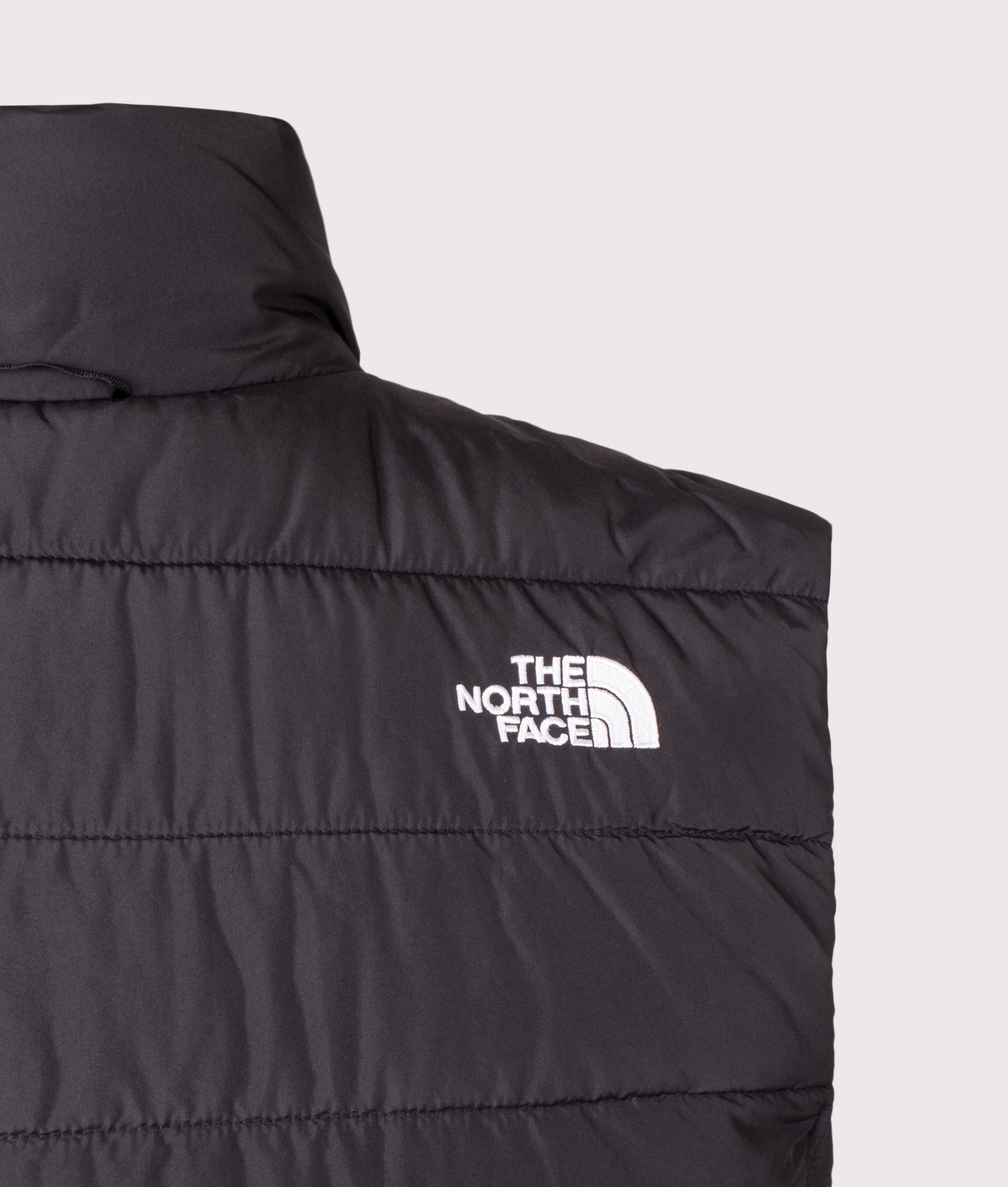 The North Face Regular Fit Aconcagua Gilet in TNF Black at EQVVS Menswear. Rear detail shot.