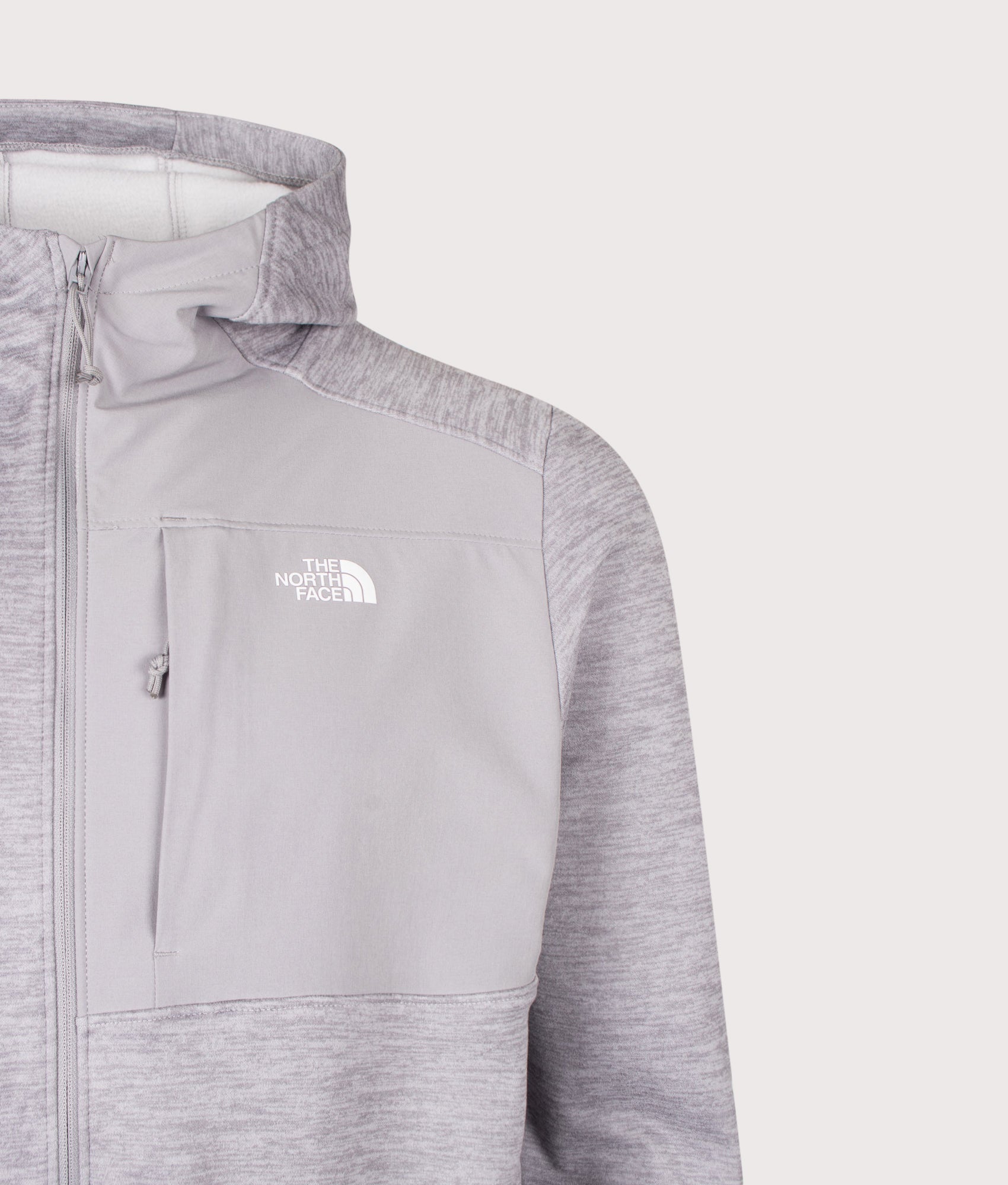 The North Face Regular Fit Performance Zip Through Fleece Hoodie in TNF Pale Grey Heather at EQVVS Menswear. Detail shot.