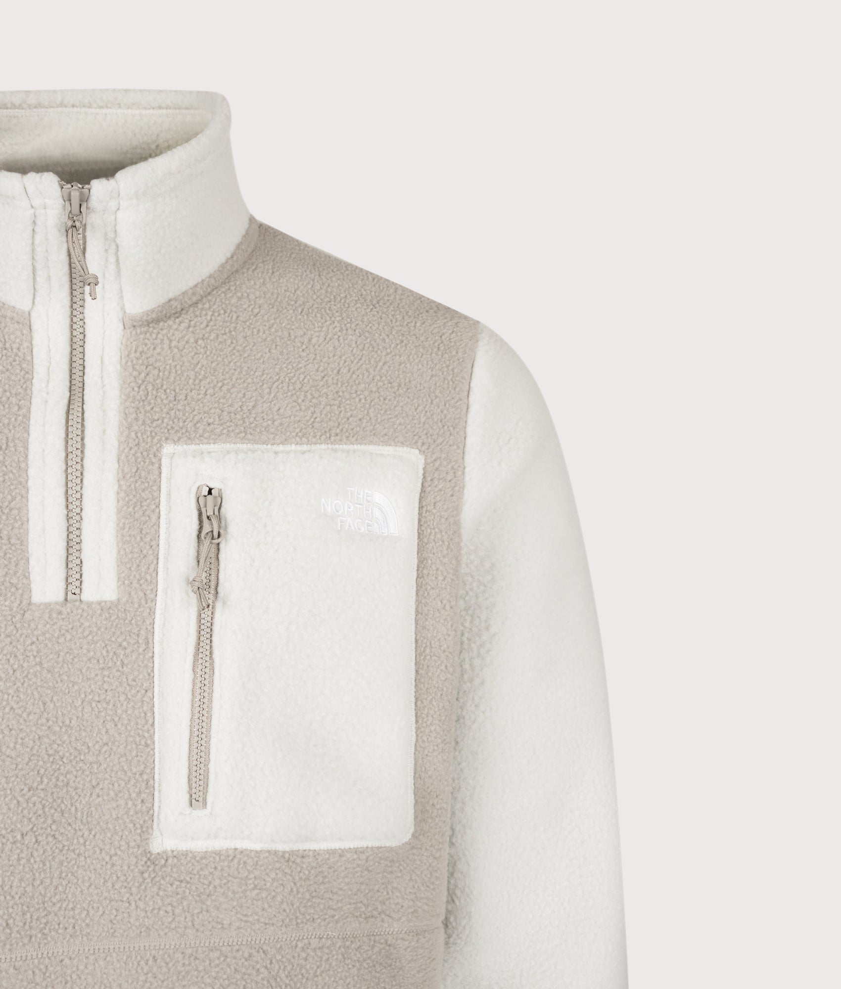 The North Face Regular Fit Yumiori Quarter Zip Fleece in Stone Slab and Cumulus Cloud at EQVVS Menswear. Detail shot.