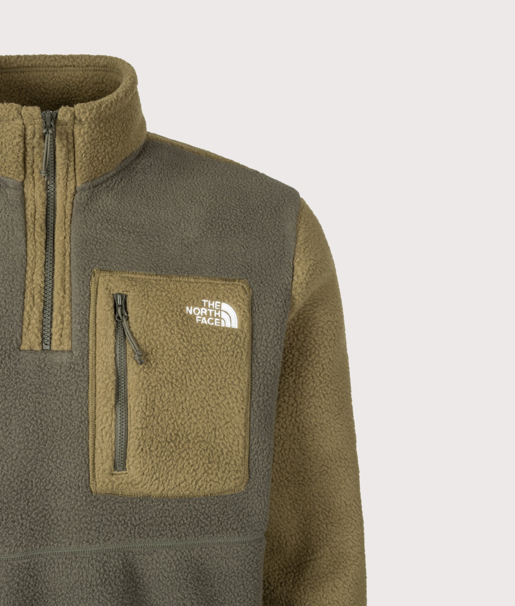 The North Face Regular Fit Yumiori Quarter Zip Fleece in New Taupe Green at EQVVS Menswear. Front detail shot.