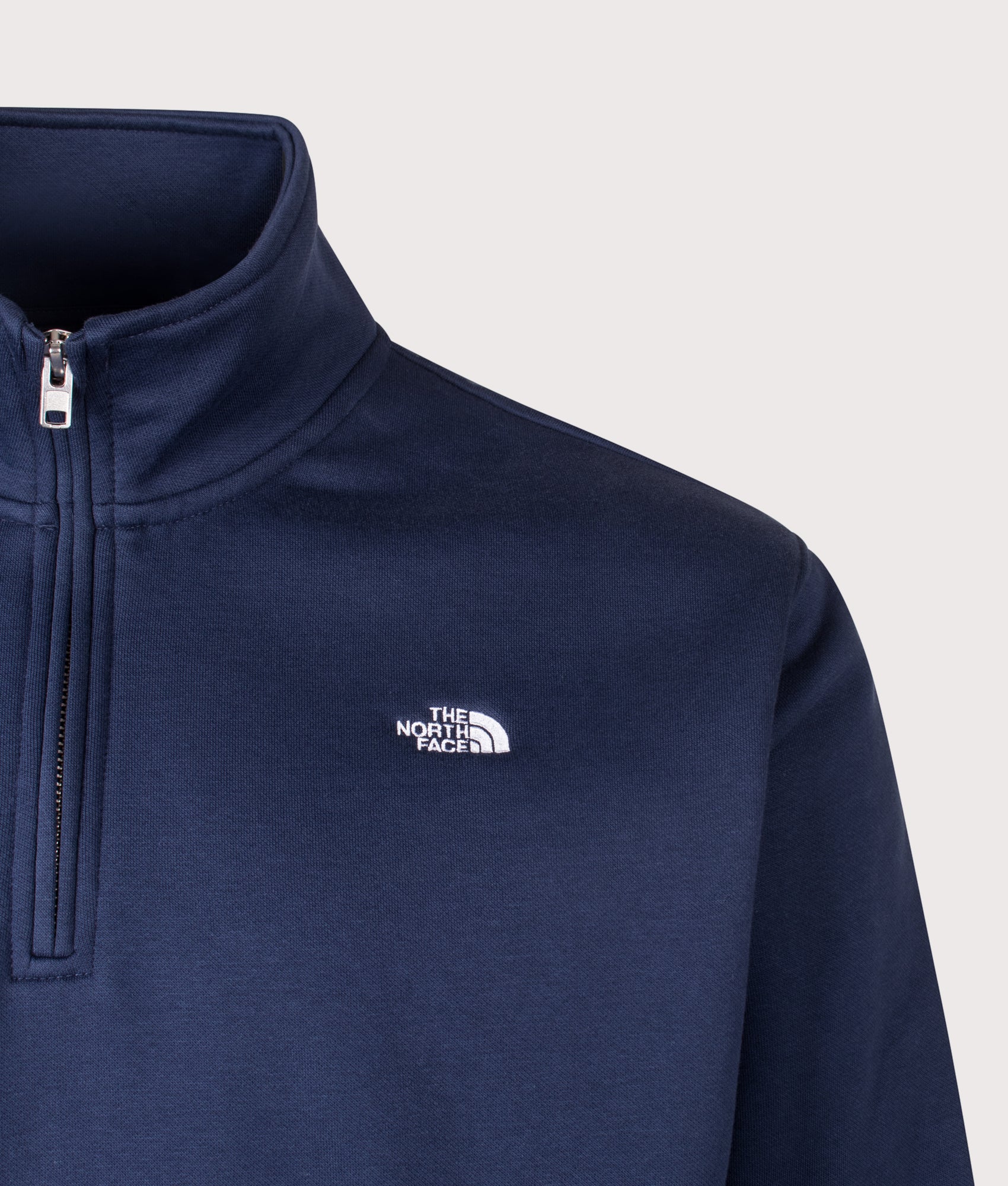 The North Face Relaxed Fit Essential Simple Dome Quarter Zip Hoodie in Summit Navy at EQVVS Menswear. Detail shot.