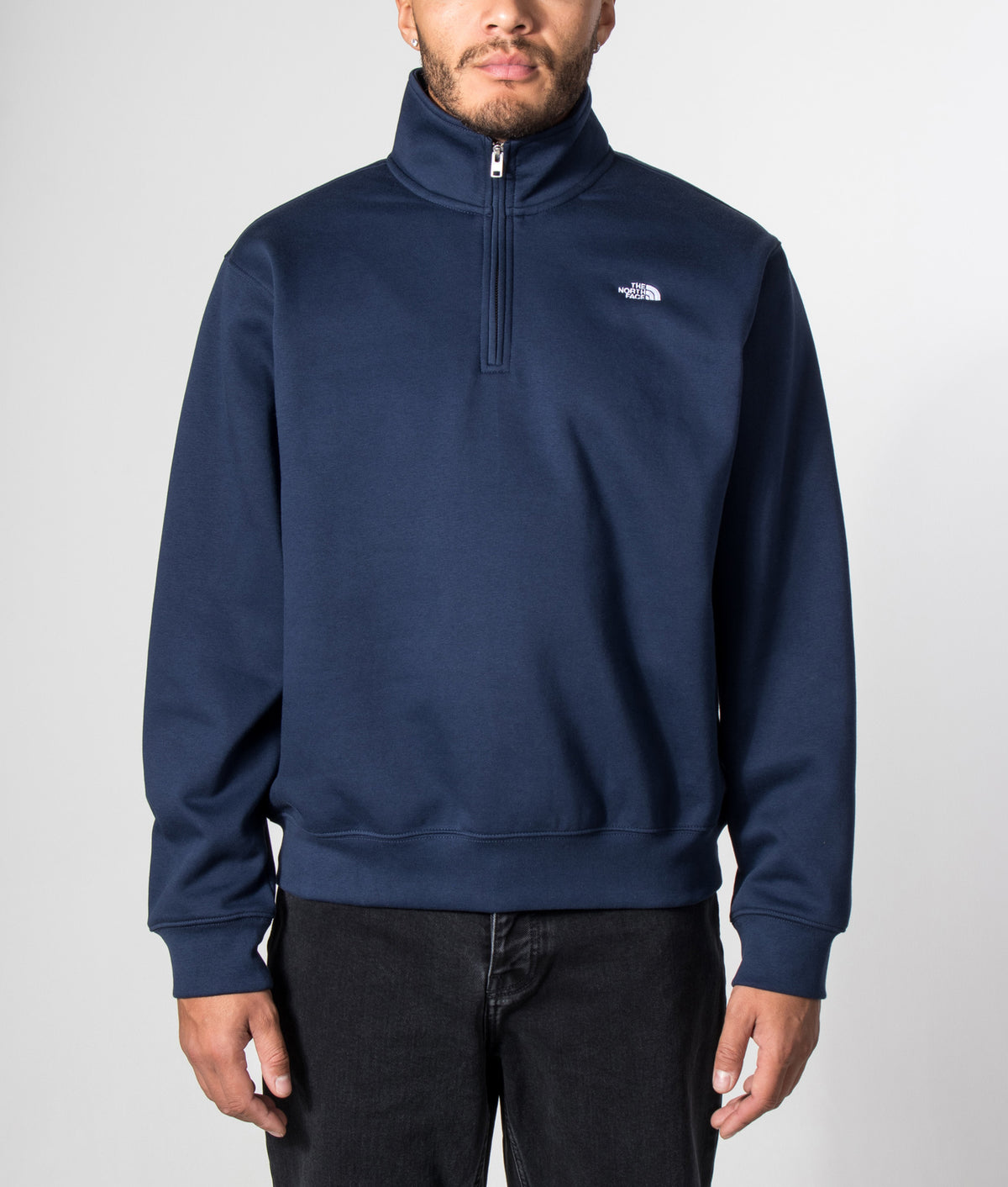 The North Face Relaxed Fit Essential Simple Dome Quarter Zip Hoodie in Summit Navy at EQVVS Menswear. Model front shot.