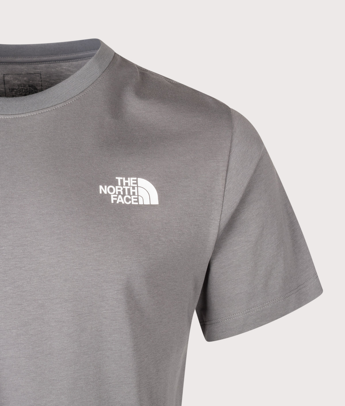 The North Face Regular Fit NSE Box Celebration T-Shirt in Smoked Pearl at EQVVS Menswear. Detail shot.