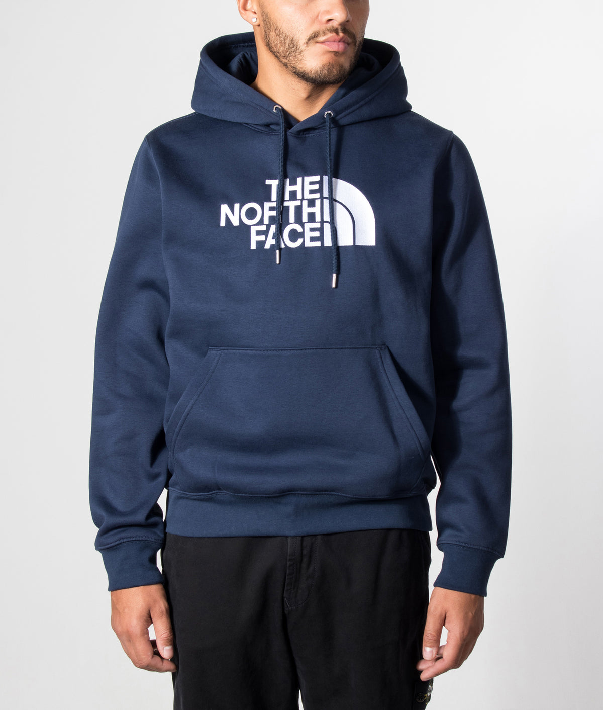 The North Face Regular Fit TNF Essential Drew Peak Hoodie in Summit Navy at EQVVS Menswear. Model front shot.