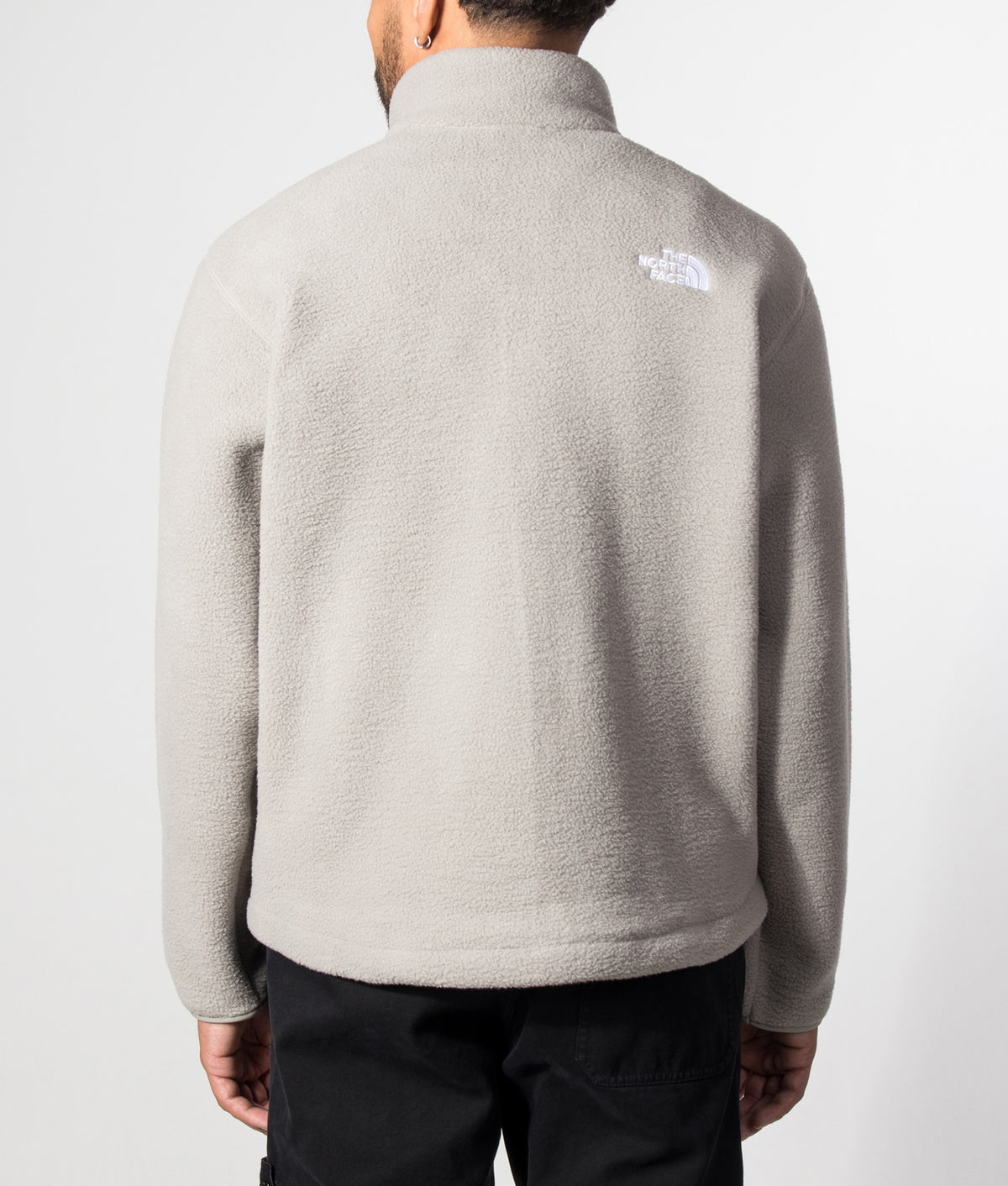 The North Face Relaxed Fit TNF Fleeski Zip Through Fleece in Stone Slab at EQVVS Menswear. Model back shot.