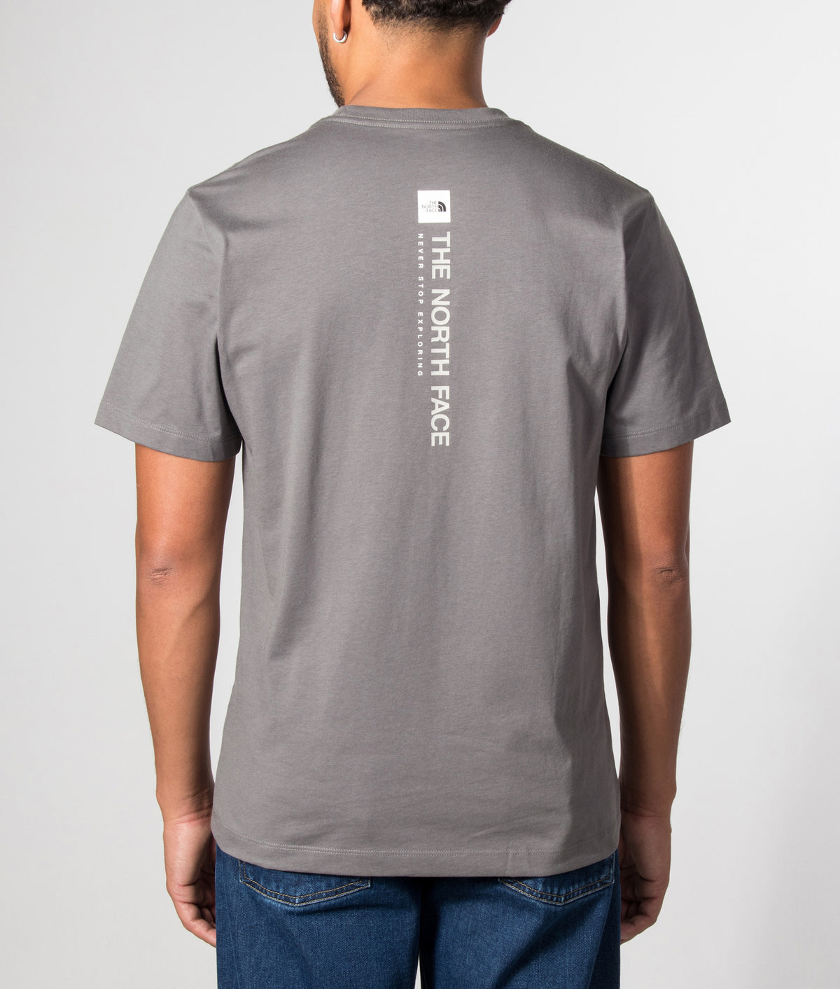 The North Face Regular Fit Vertical Graphic T-Shirt in Smoked Pearl at EQVVS Menswear. Model back shot.