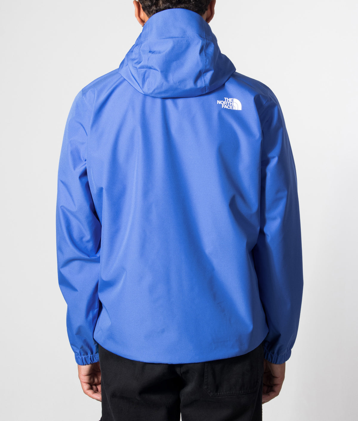 The North Face Regular Fit Quest DryVent™ Jacket in Active Blue at EQVVS Menswear. Model back shot.