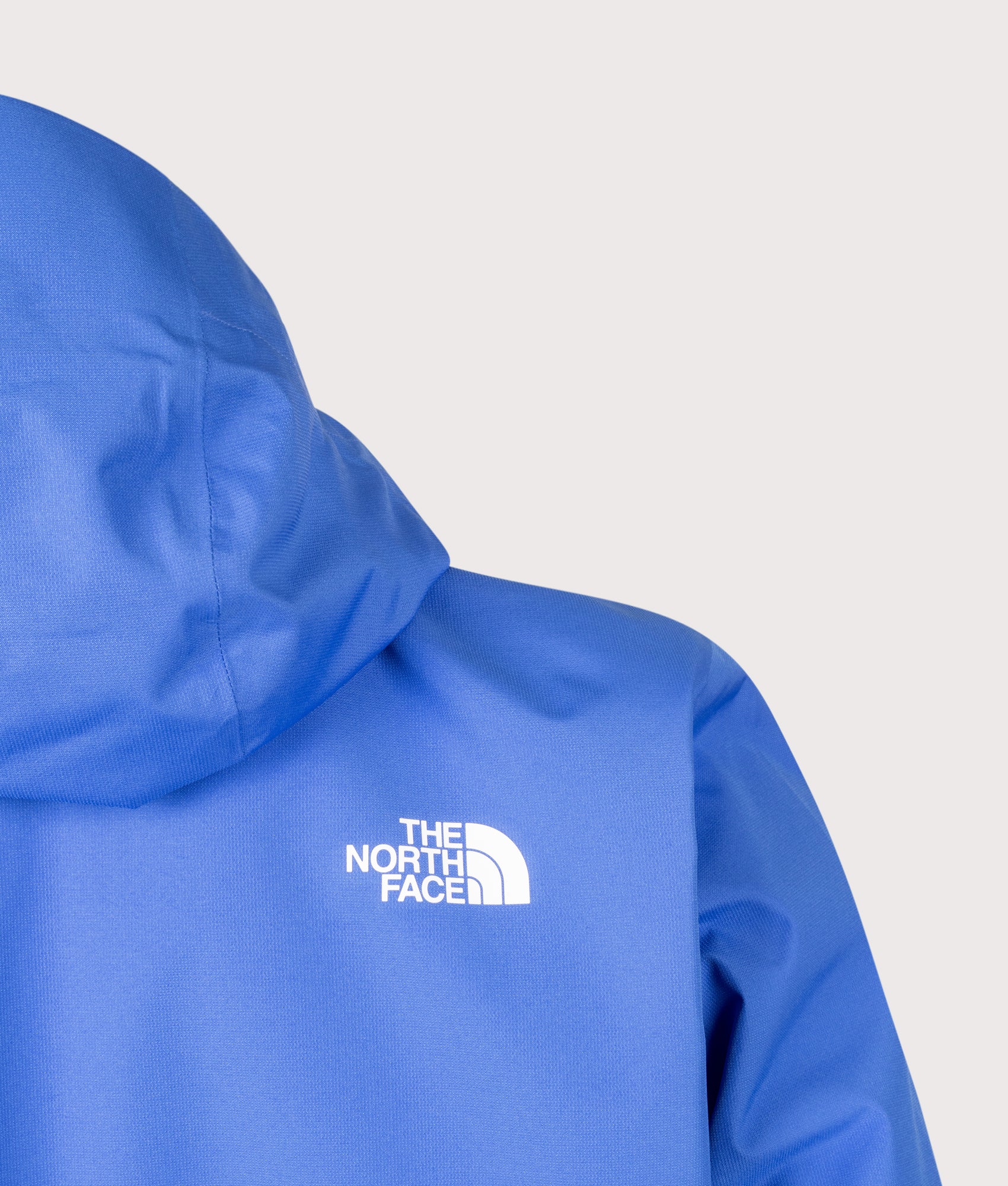The North Face Regular Fit Quest DryVent™ Jacket in Active Blue at EQVVS Menswear. Back shot.