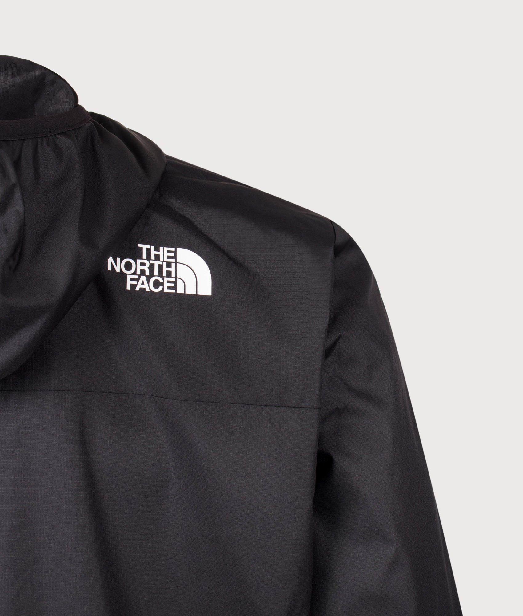 The North Face Regular Fit Nuketo Windbreaker in TNF Black at EQVVS Menswear. Back detail shot.
