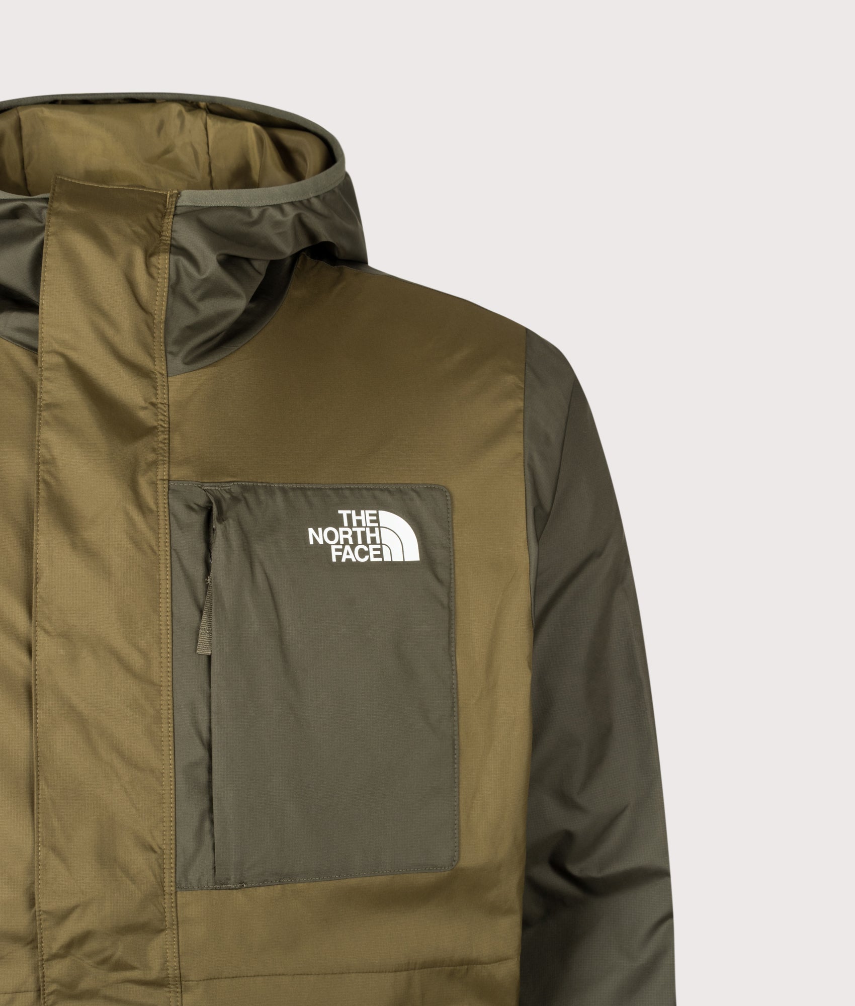 The North Face Regular Fit Nuketo Windbreaker in Caraway Seed and New Taupe Green at EQVVS Menswear. Detail shot.