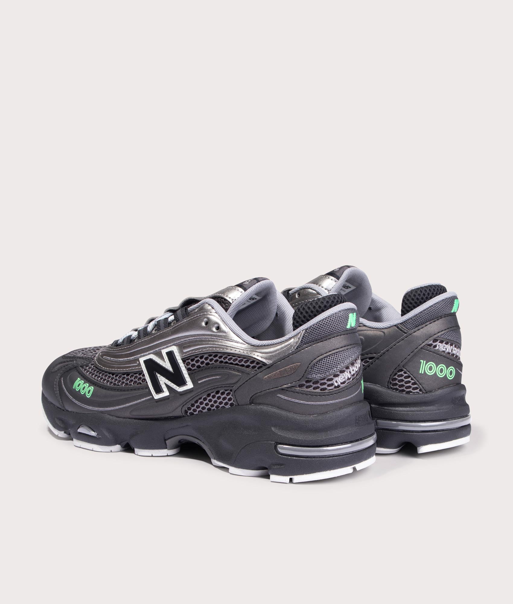 New Balance 1000 Sneakers in Black, Dark Silver Metallic and Lime Leaf at EQVVS Menswear. Angled back shot.