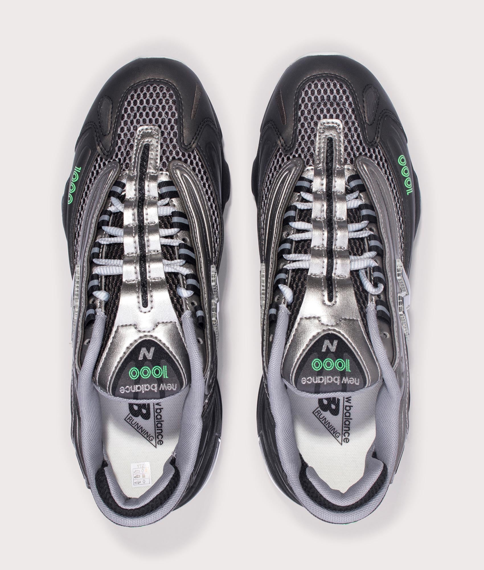 New Balance 1000 Sneakers in Black, Dark Silver Metallic and Lime Leaf at EQVVS Menswear. Above shot.