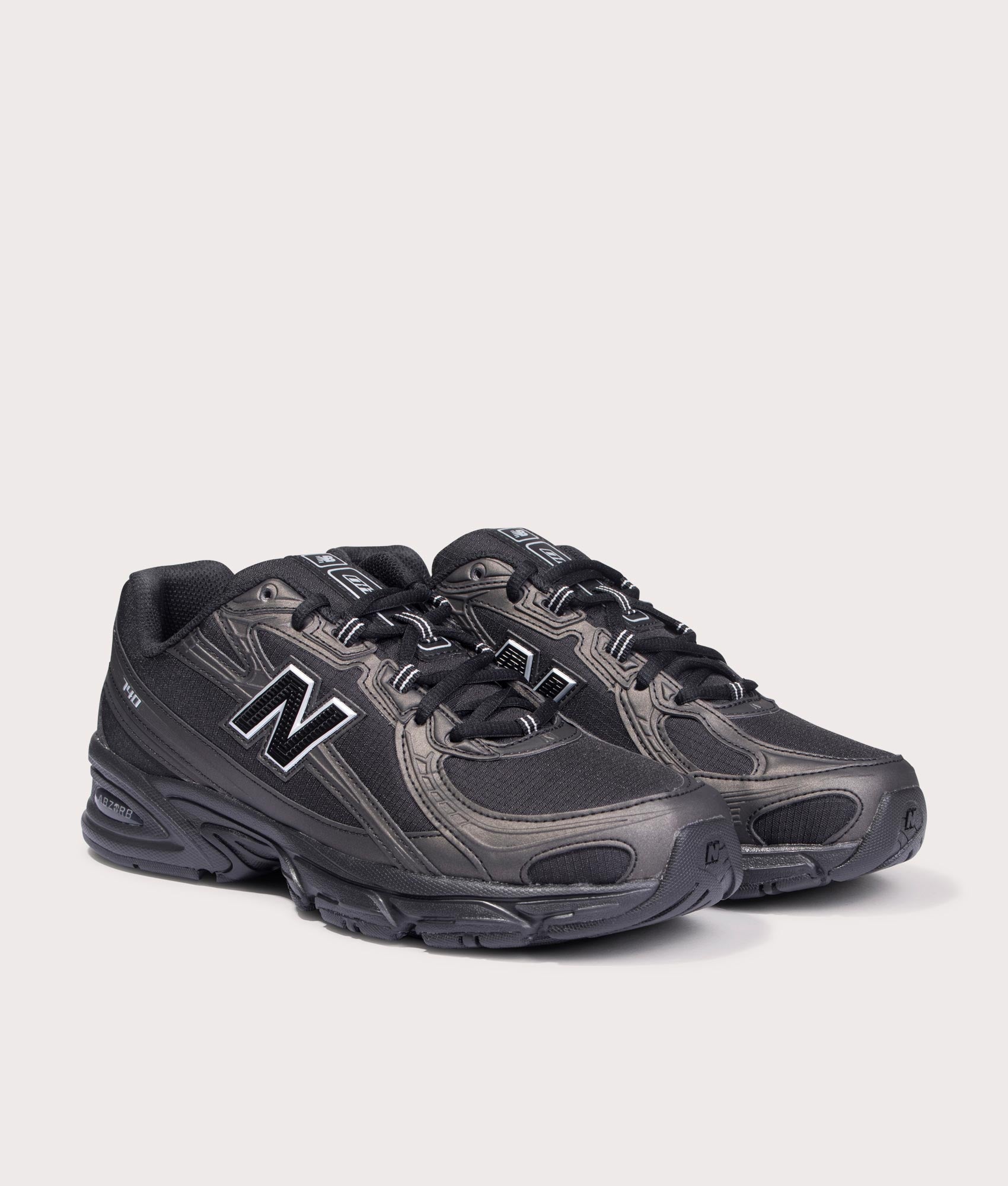 New Balance 740 in Black at EQVVS Menswear. Angled front shot.