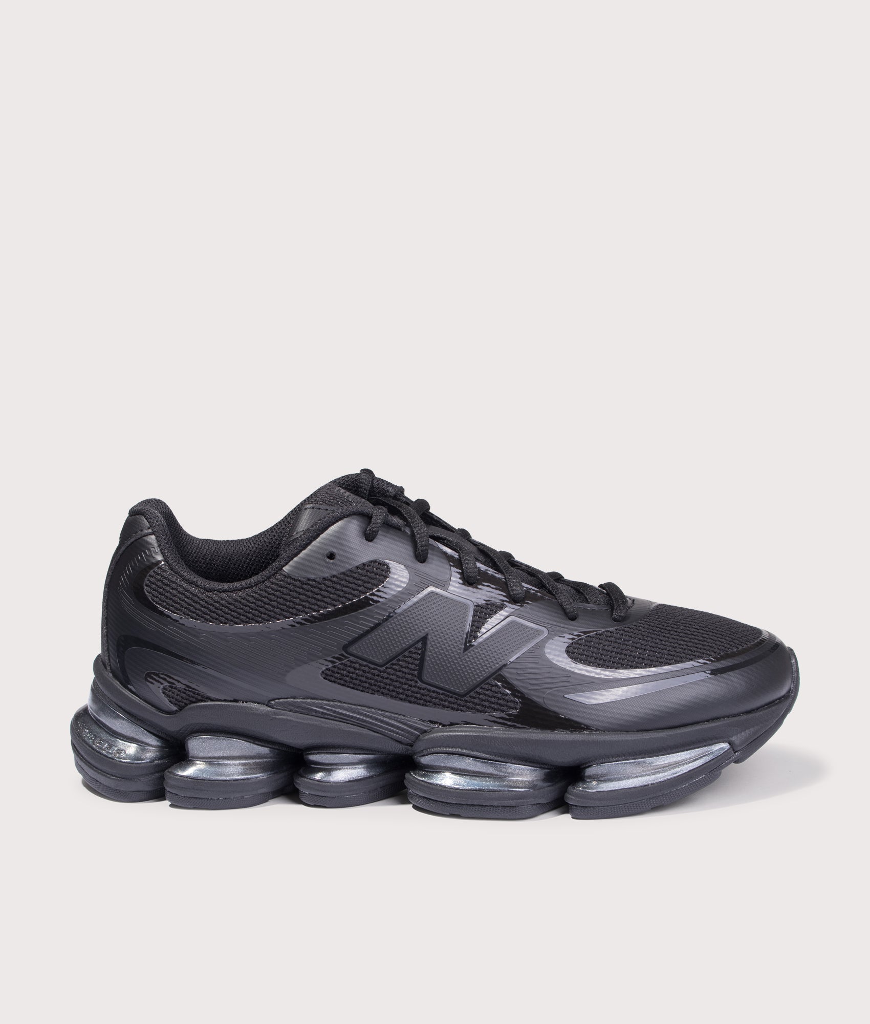 New Balance ABZORB 2000 in Black at EQVVS Menswear. Side shot. 