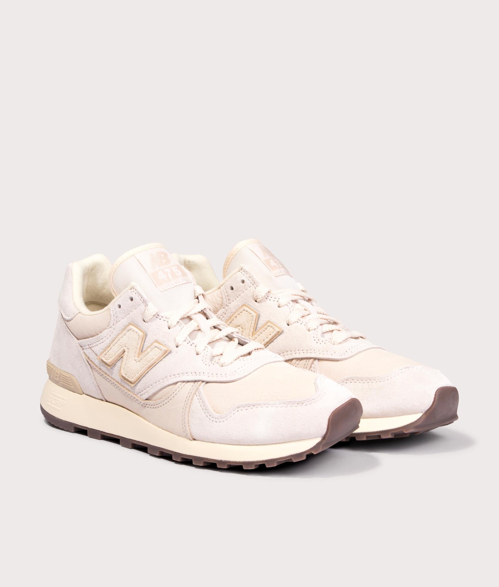 New Balance 475 in Bisque at EQVVS Menswear. Angled front shot.