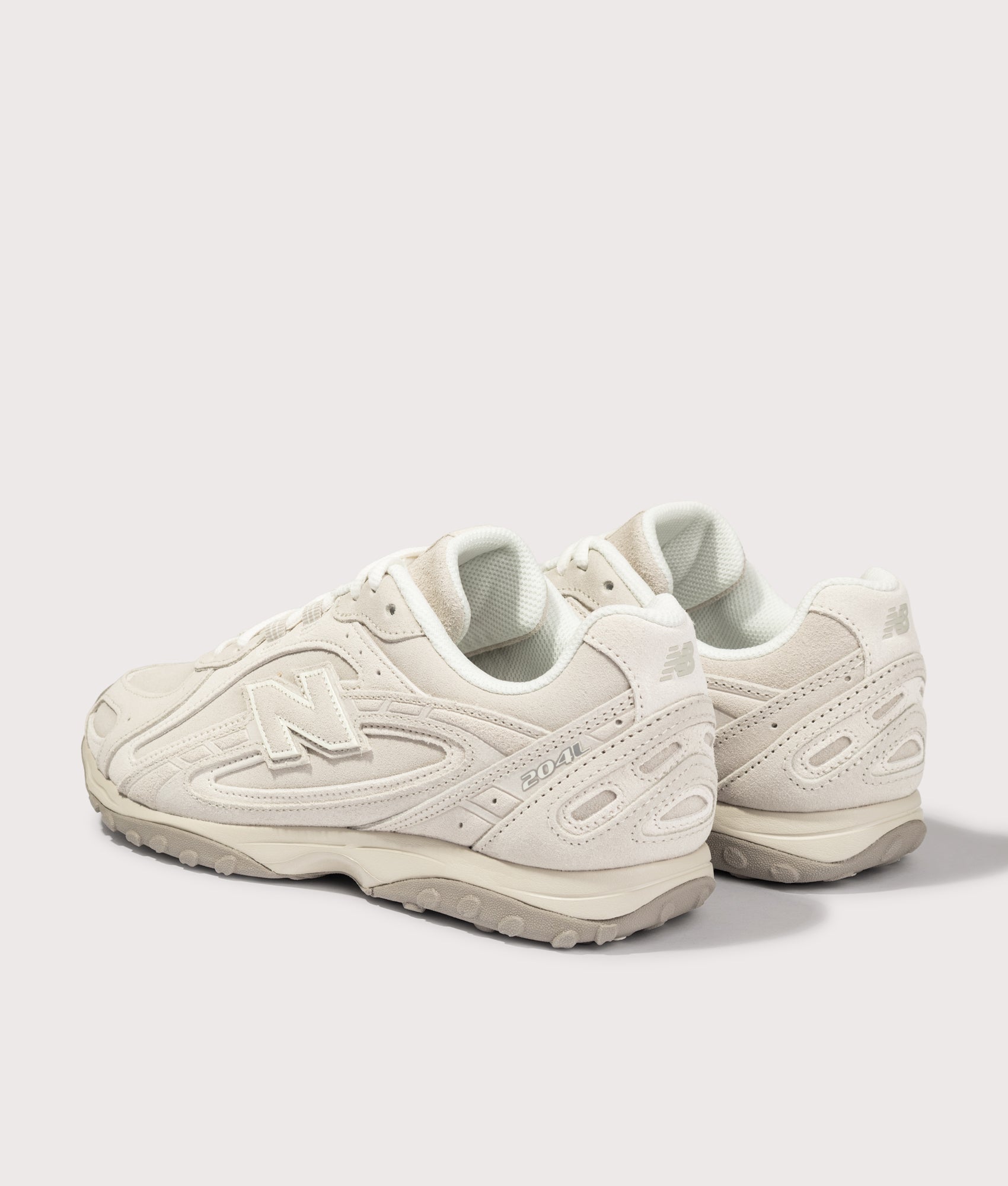 New Balance 204L Sneakers in Timberwolf and Linen at EQVVS Menswear. Angled back shot.