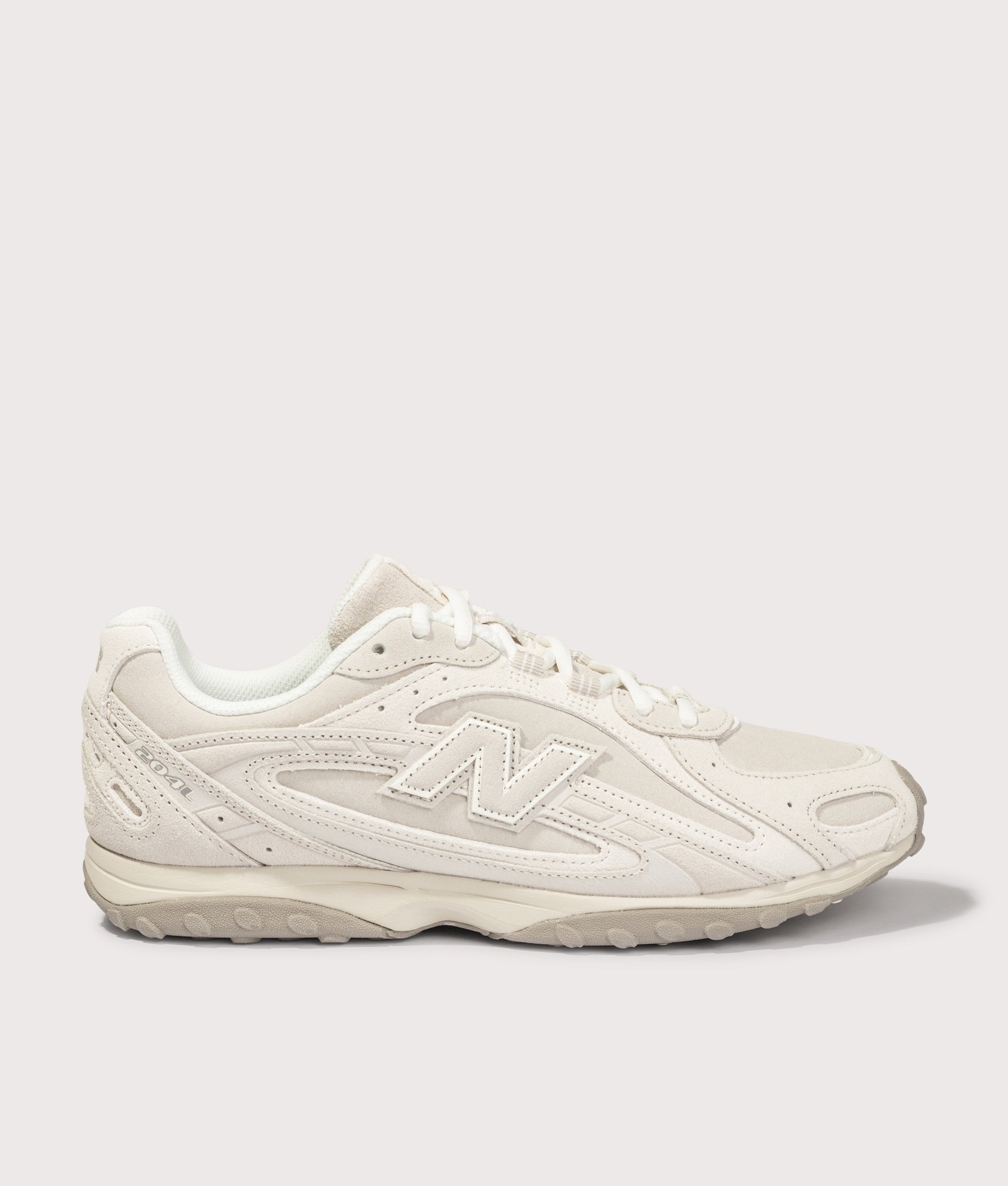 New Balance 204L Sneakers in Timberwolf and Linen at EQVVS Menswear. Side shot.