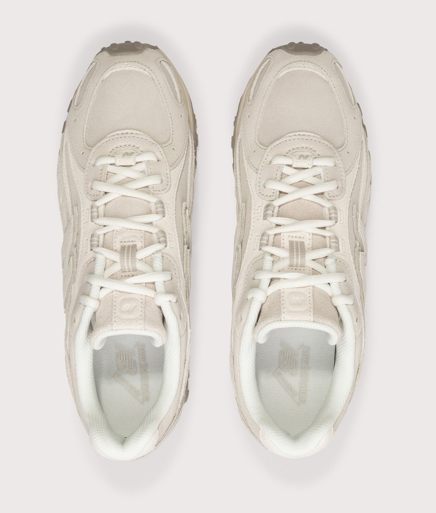 New Balance 204L Sneakers in Timberwolf and Linen at EQVVS Menswear. Top shot.
