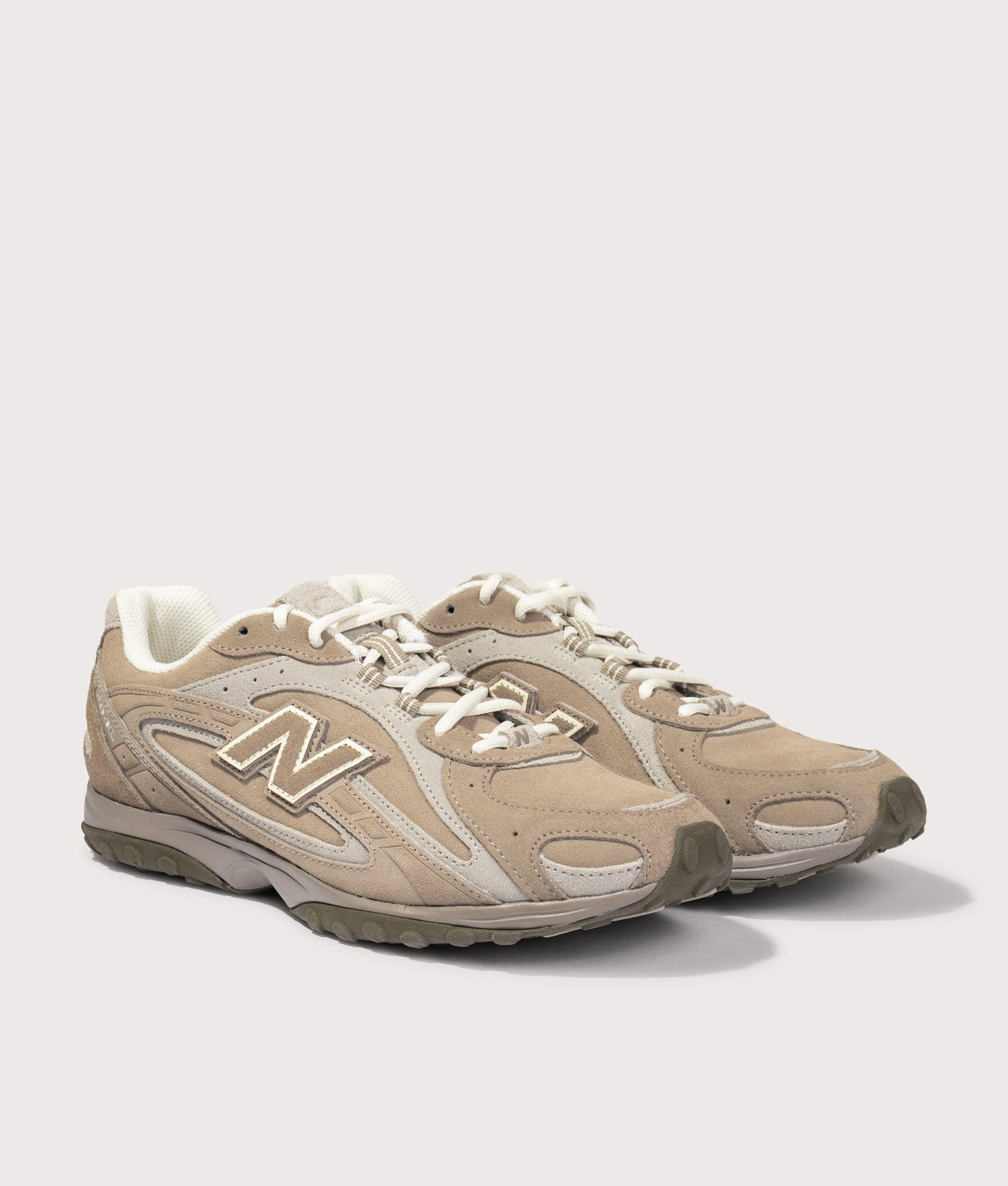 New Balance 204L Sneakers in Mushroom/Arid Stone at EQVVS Menswear. Angled front shot.