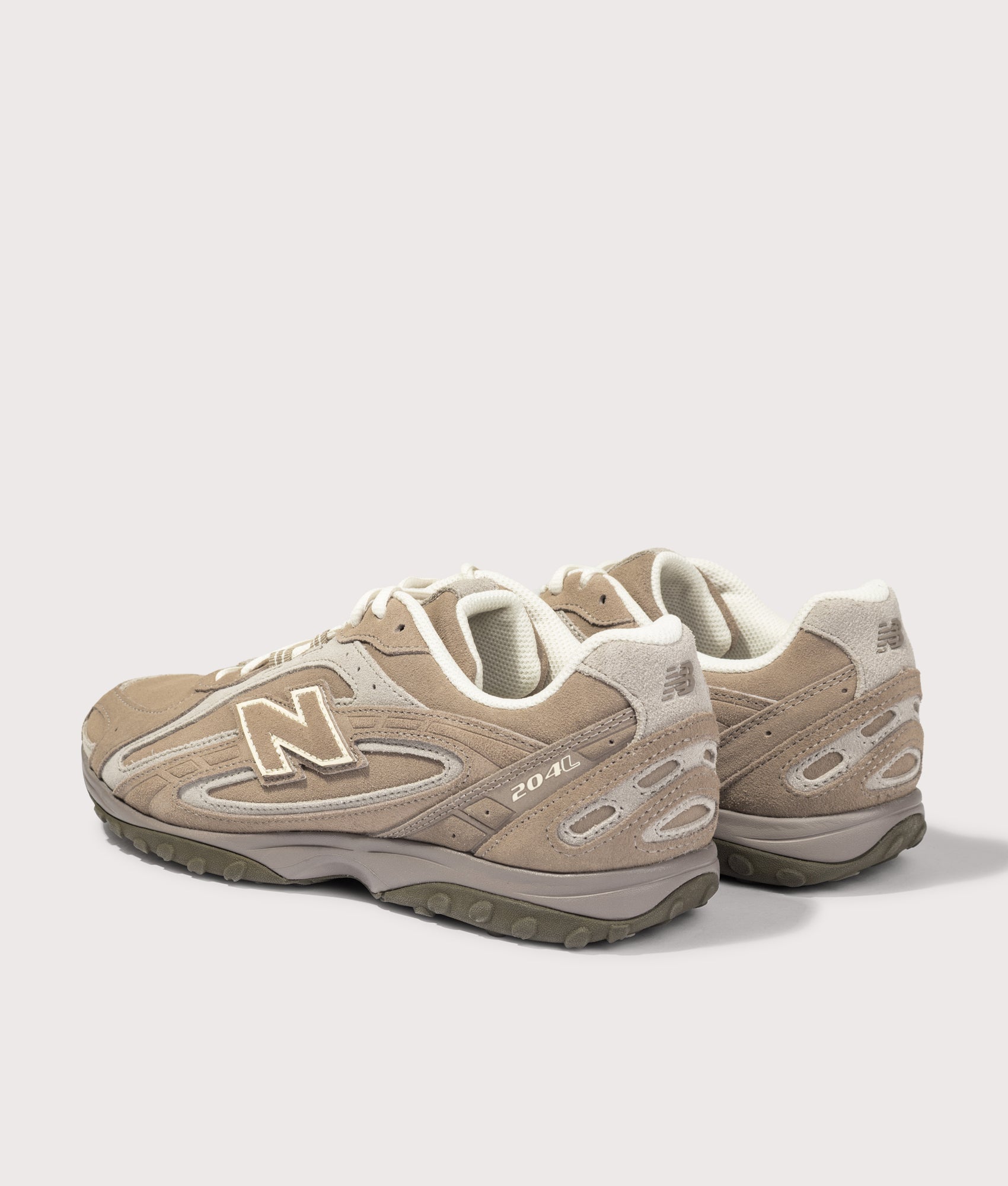 New Balance 204L Sneakers in Mushroom/Arid Stone at EQVVS Menswear. Angled bak shot.