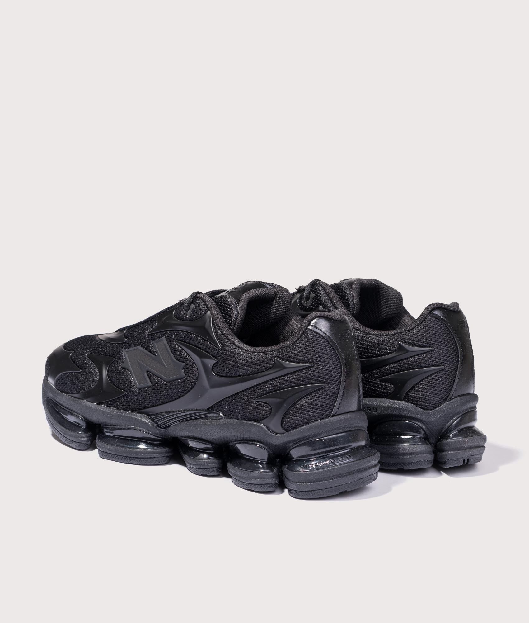 ABZORB 2000 in Black Metallic | New Balance | EQVVS | Back angle shot 
