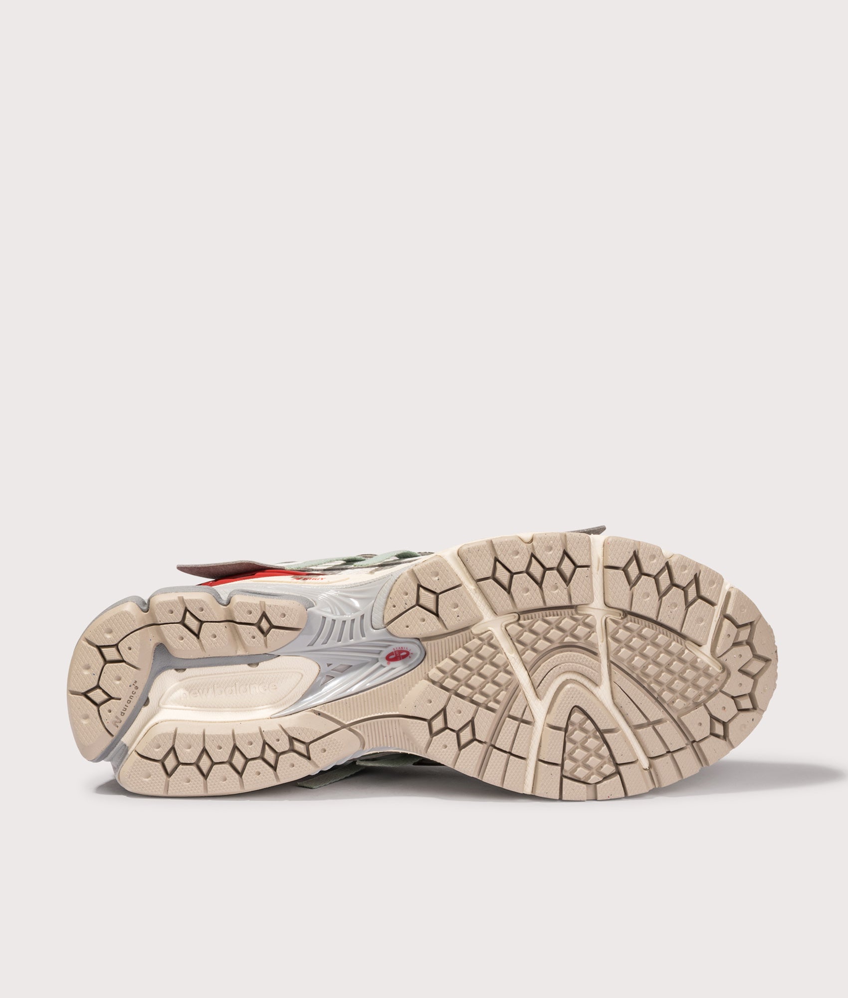 New Balance 1906A Sneakers in Sea Salt and Lone star grey at EQVVS Menswear. Tread shot.