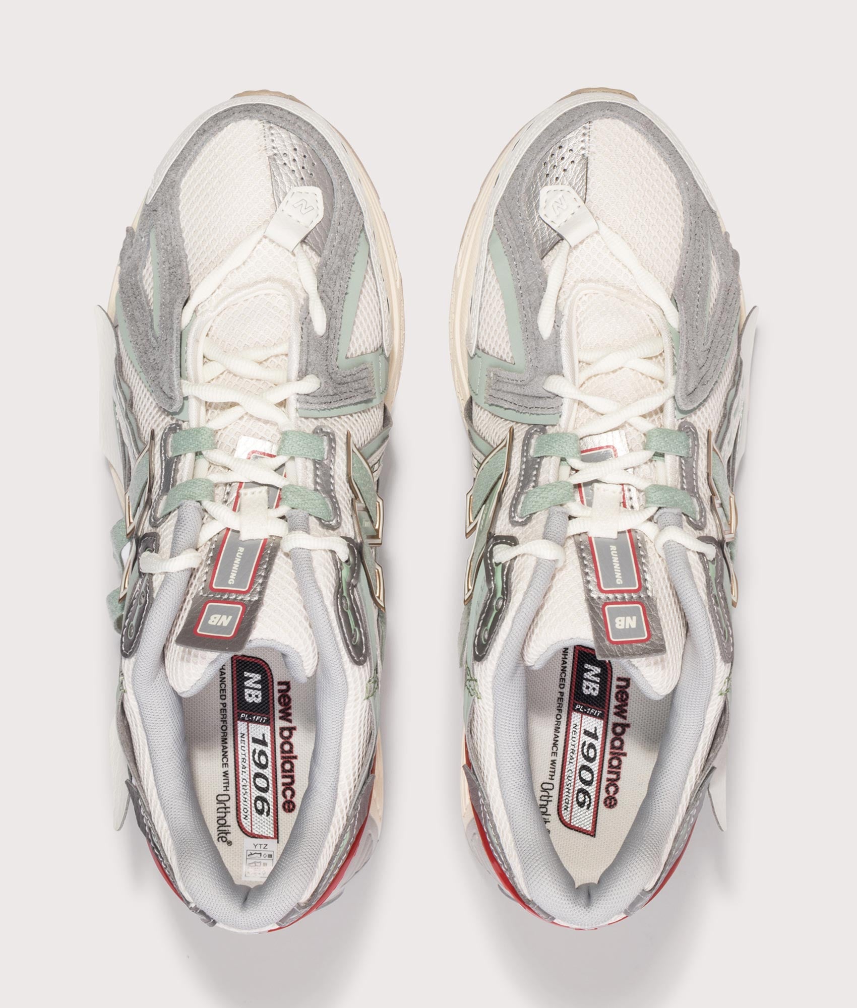 New Balance 1906A Sneakers in Sea Salt and Lone star grey at EQVVS Menswear. Top shot.
