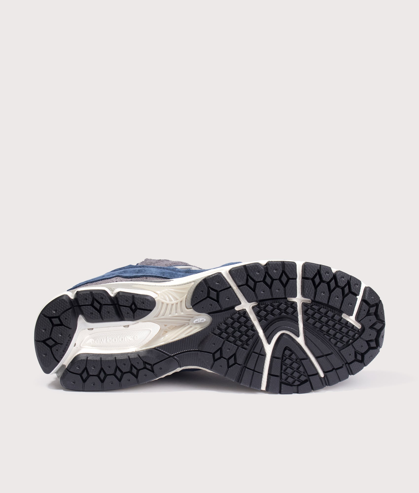 New Balance 2002D Protection Pack Sneakers in NB Navy at EQVVS Menswear. Tread shot.