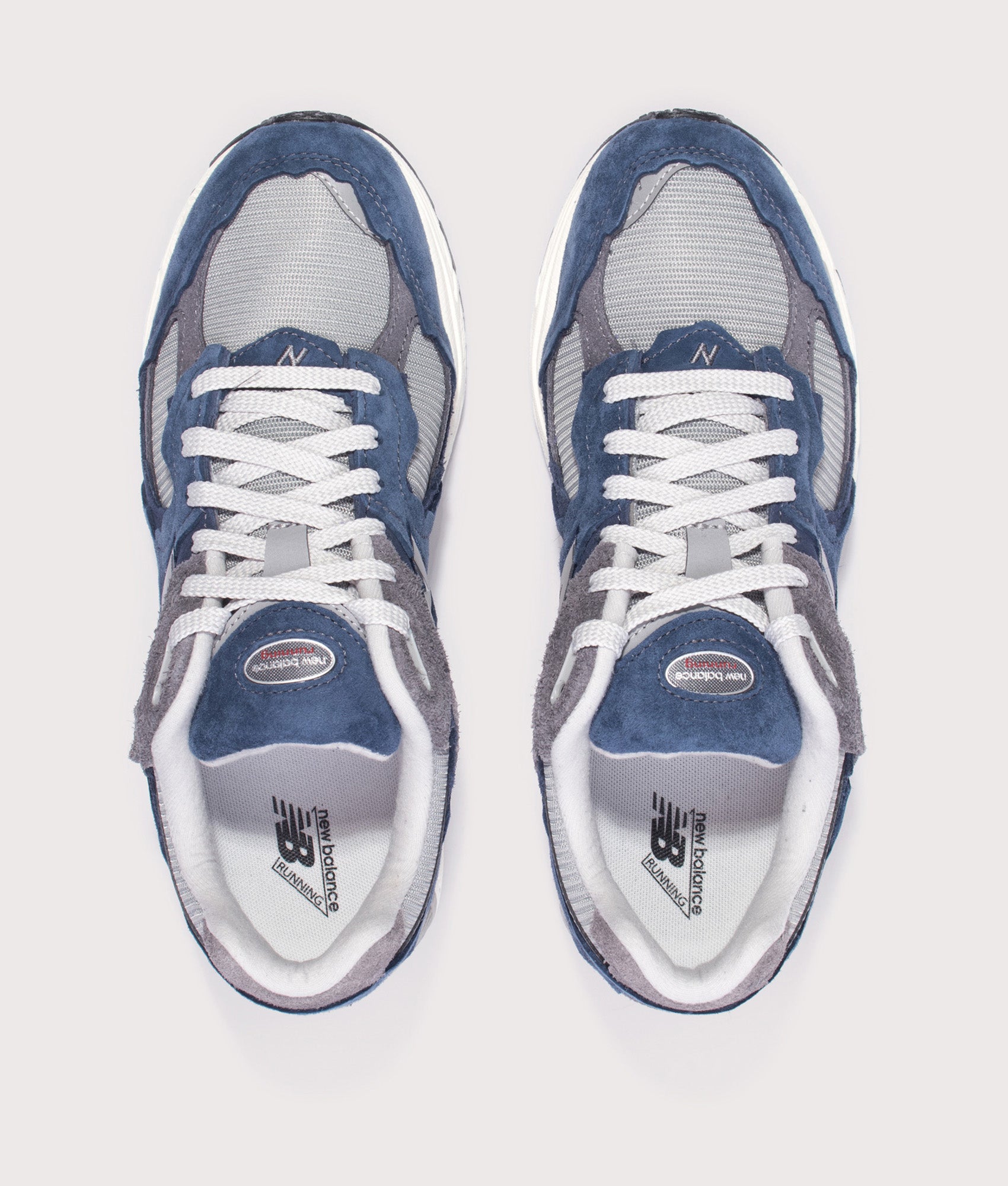 New Balance 2002D Protection Pack Sneakers in NB Navy at EQVVS Menswear. Top shot.